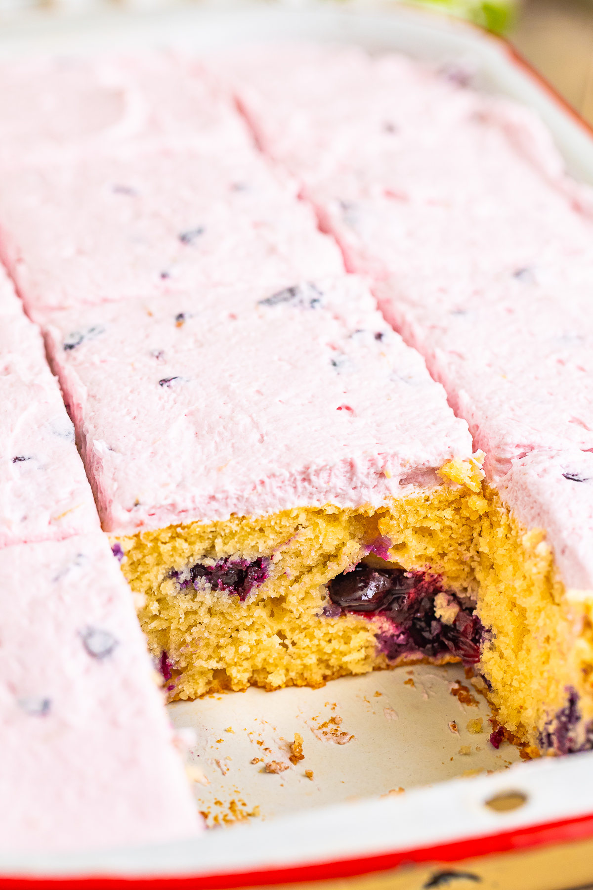 Blueberry Cake in baking dish with a slice taken out