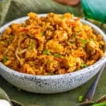 A bowl of better than takeout chicken fried rice topped with green onions
