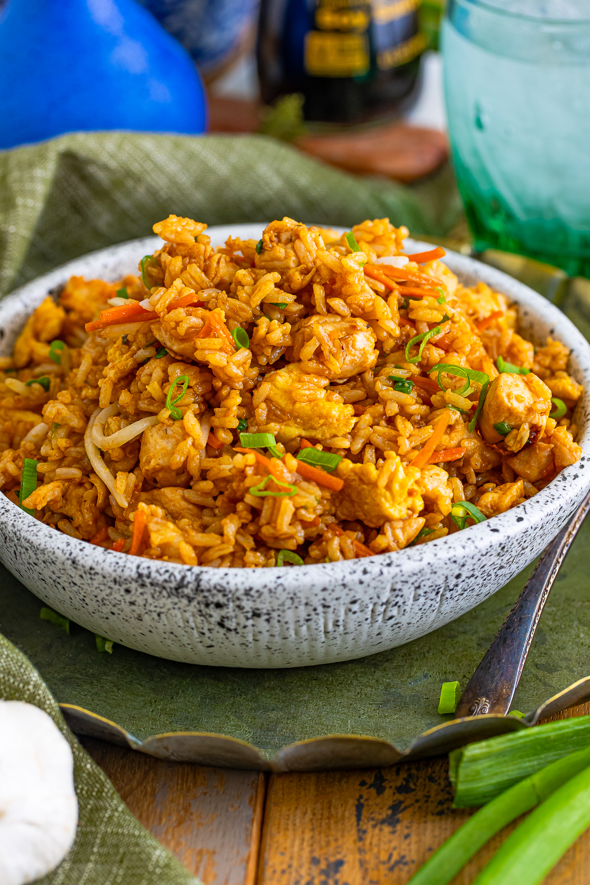 Chicken Fried Rice served in speckled bowl on wooden table top