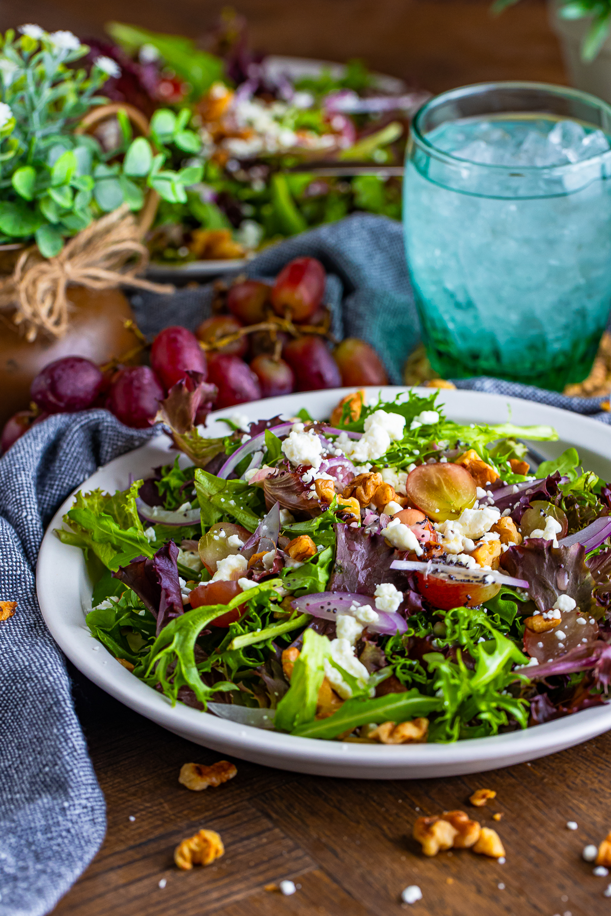 a table top showing two portions of Goat Cheese Salad