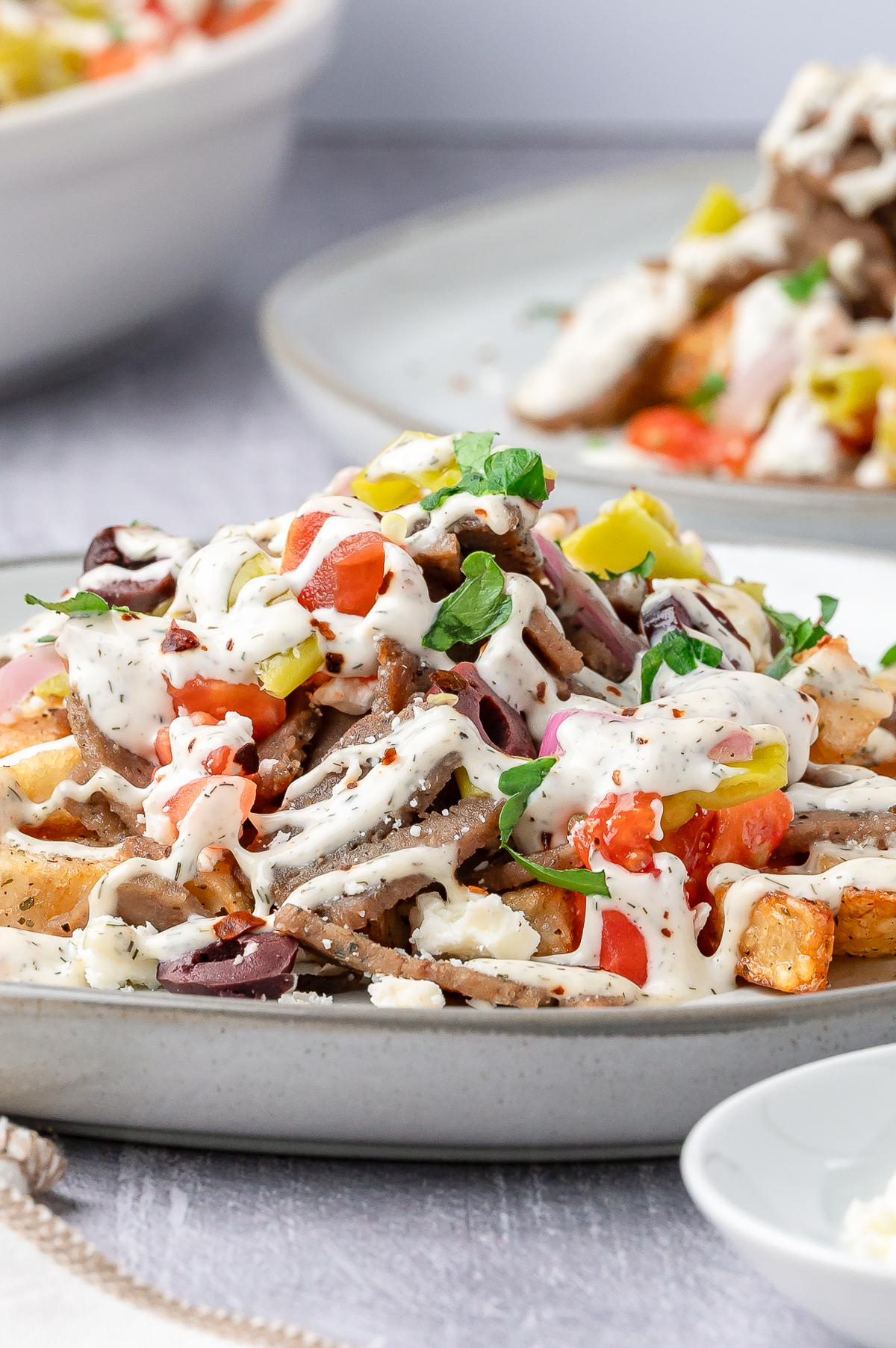 Greek Fries piled high on a plate