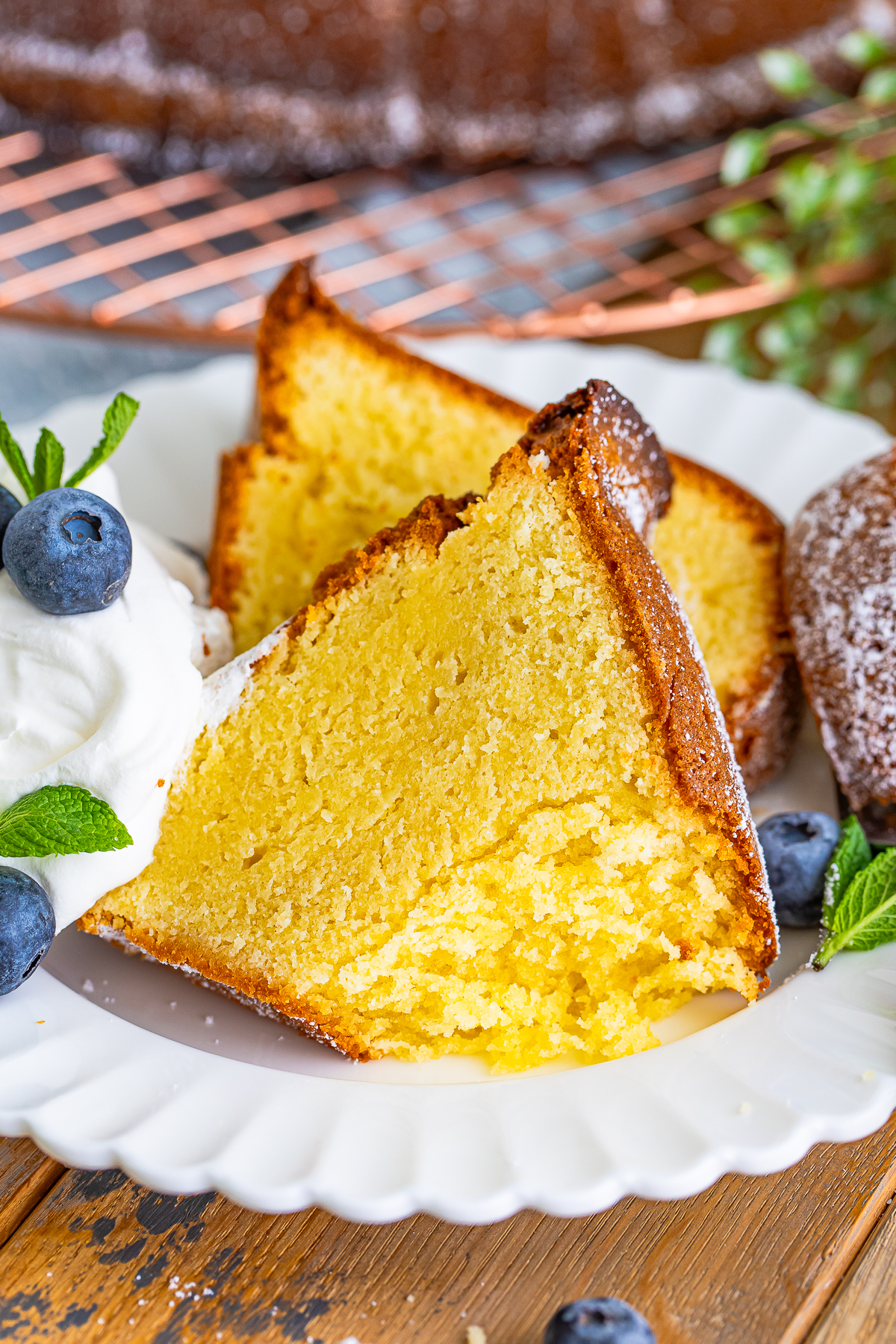 slice of Pound Cake on a white plate with a bite taken out