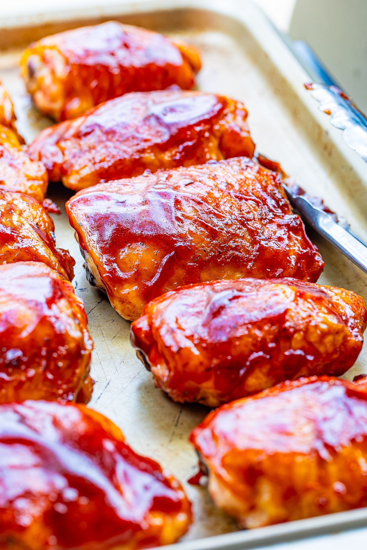 Smoked Chicken Thighs placed on a sheet tray right after smoking