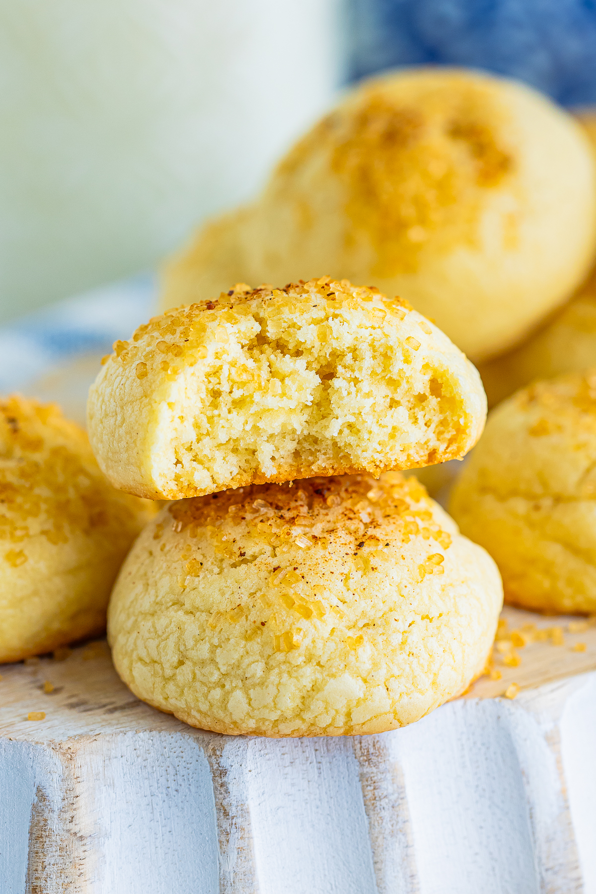 two Teacake cookies stacked on top of each other, the one on top with a bite taken out