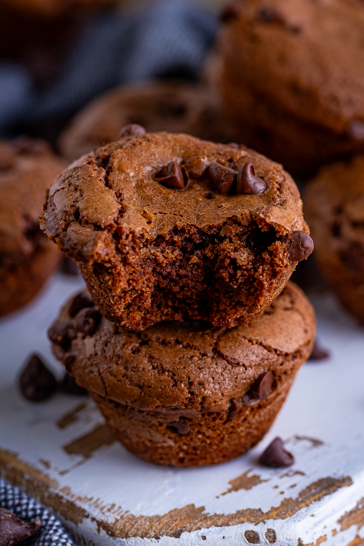 two 2 stacked on top of each other the one on top has a bite taken out