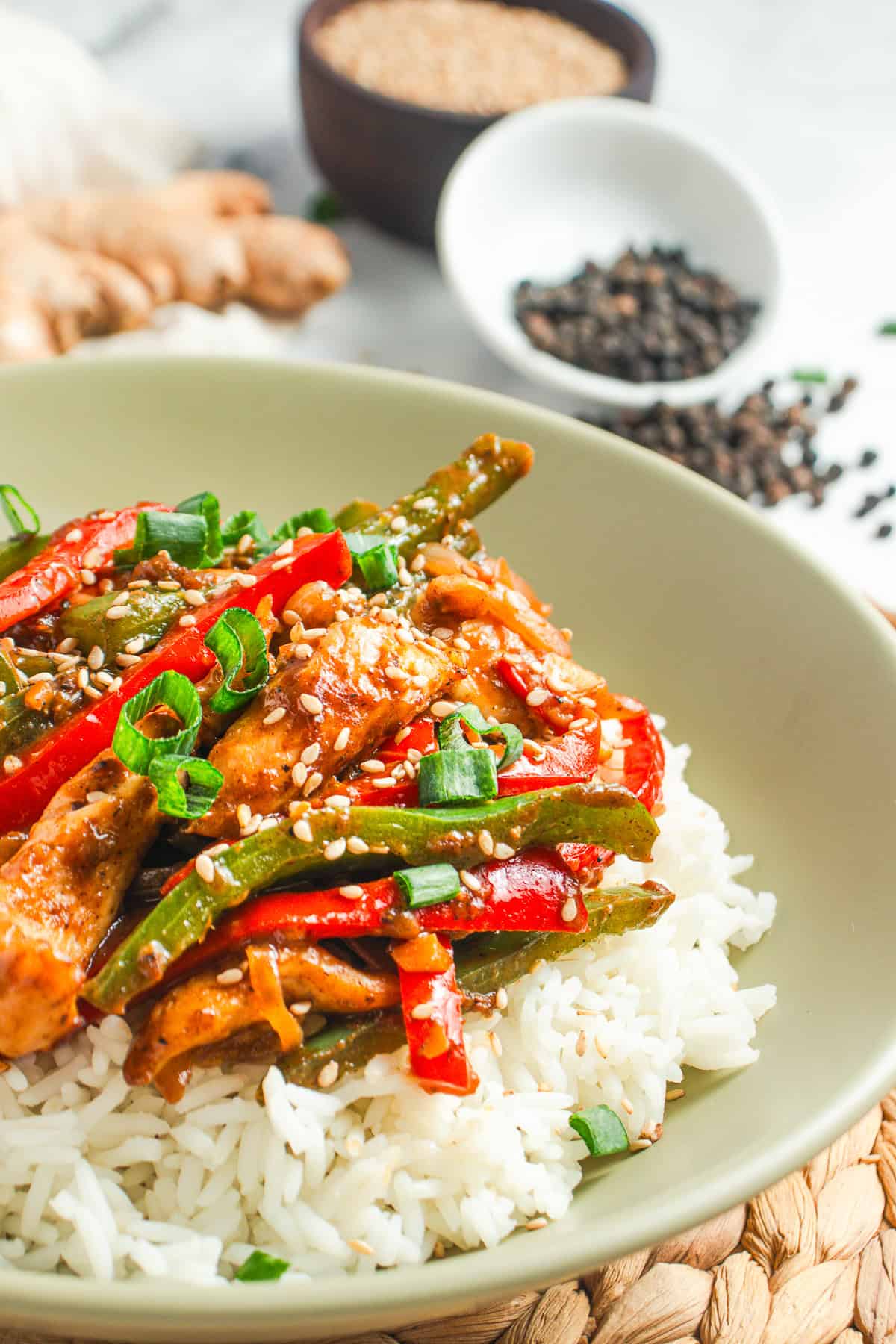 Black Pepper Chicken in a serving bowl over rice