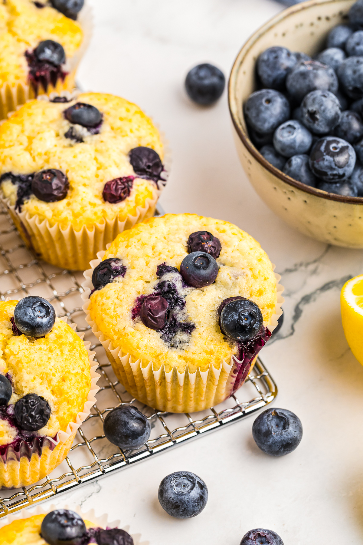 overhead image of Lemon Blueberry Muffins on a wire rack