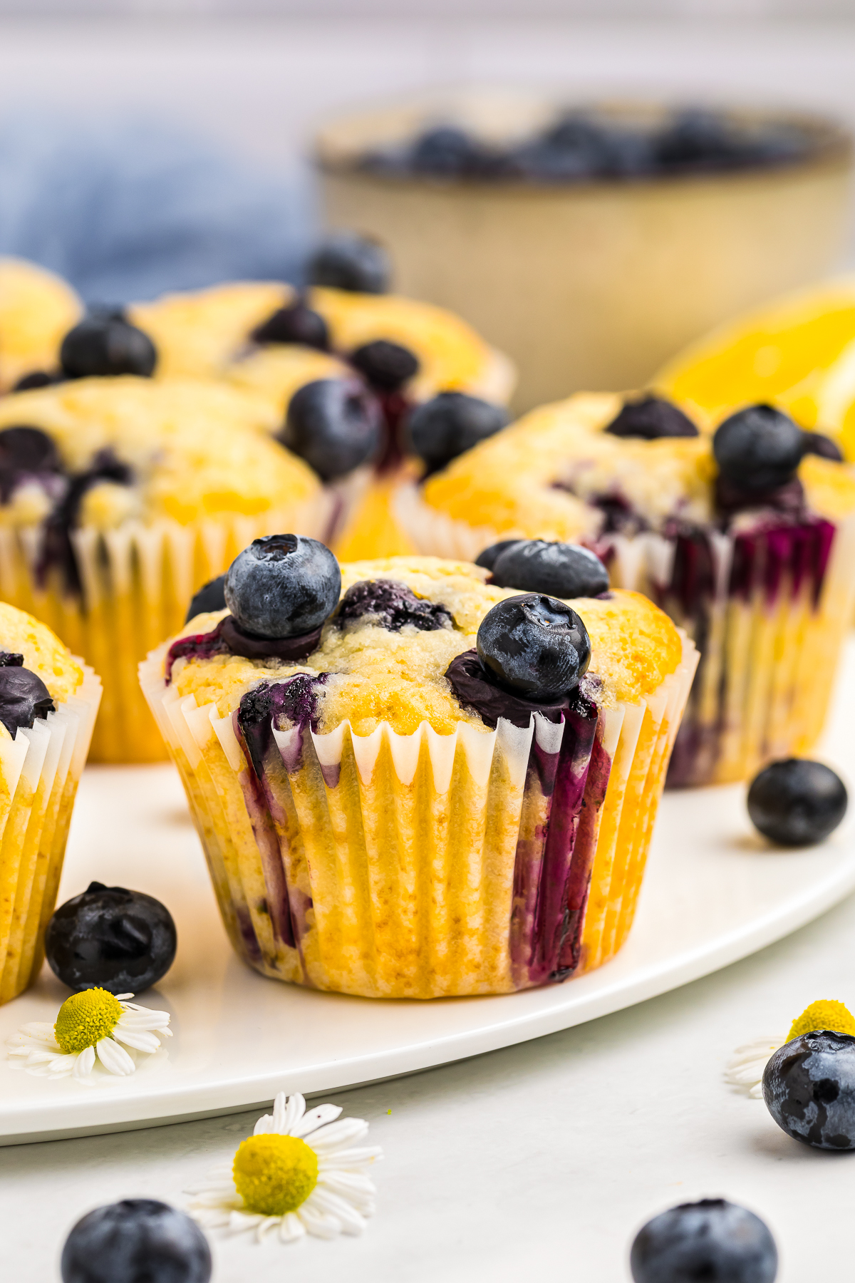 Lemon Blueberry Muffins served on a white cake server