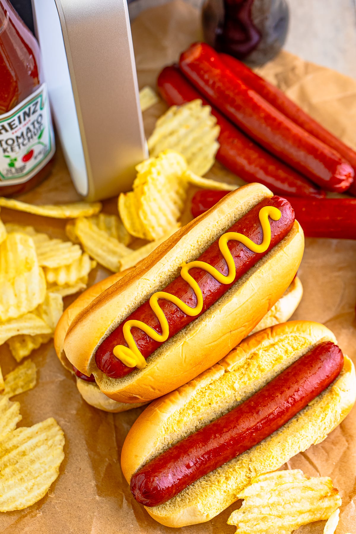 overhead image of finished Air Fry Hot Dogs on parchment paper