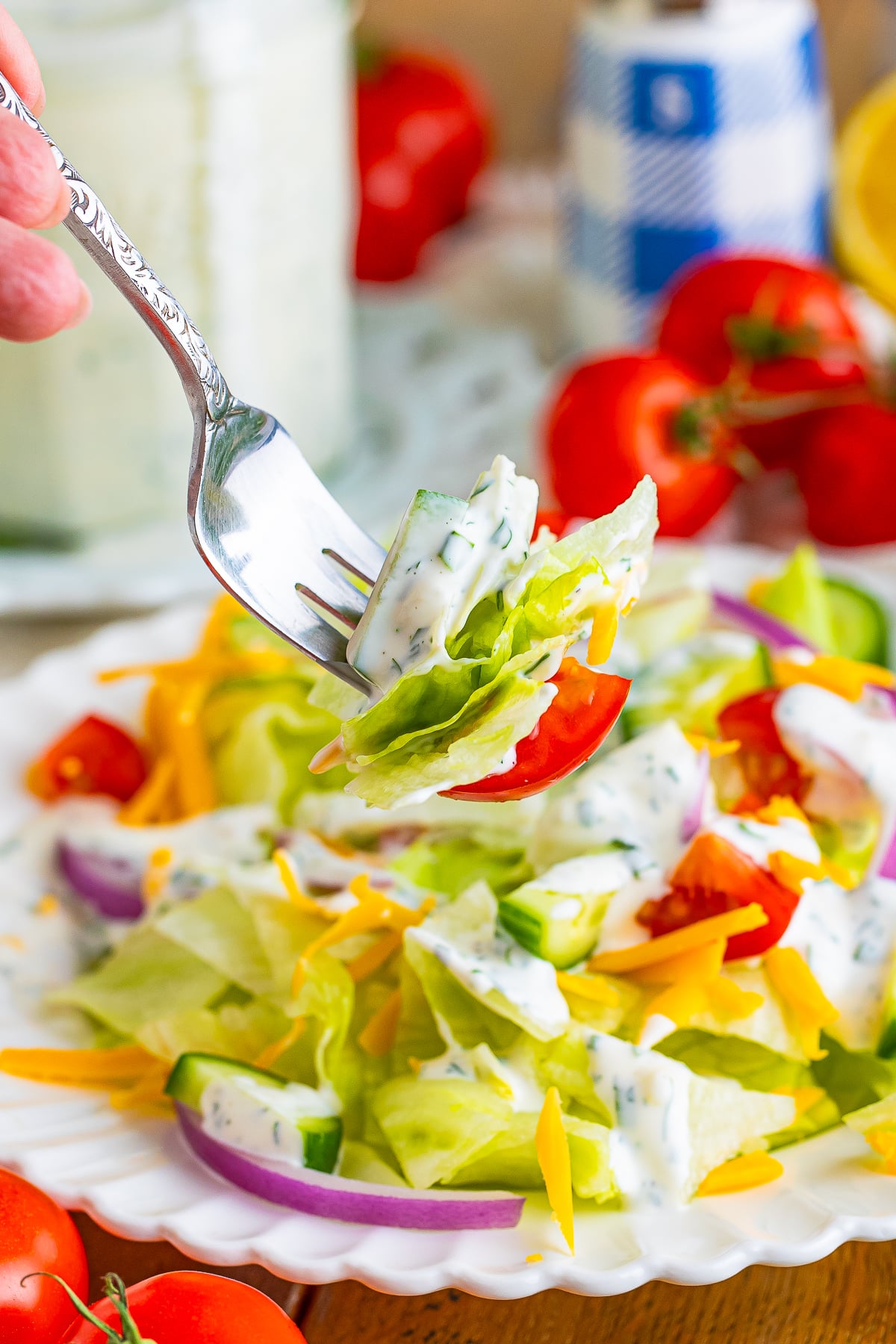 a fork holding up a bite of salad with Buttermilk Ranch Salad Dressing on it