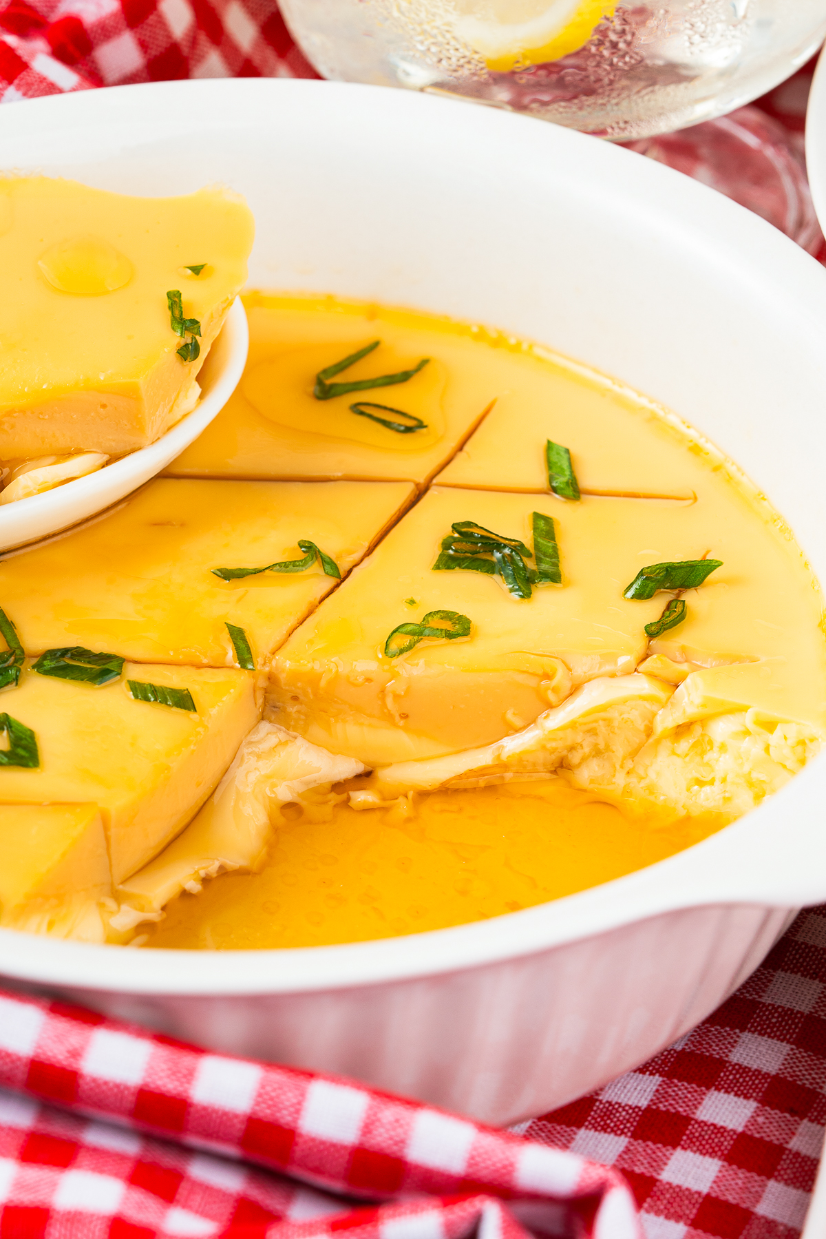 upclose image of Chinese Steamed Eggs Recipe in baking dish with a bite taken out