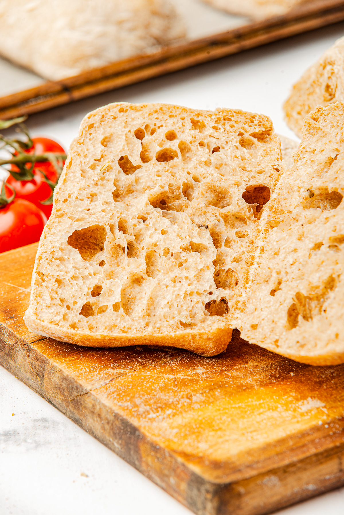 Ciabatta Bread Rolls on a board, sliced in half