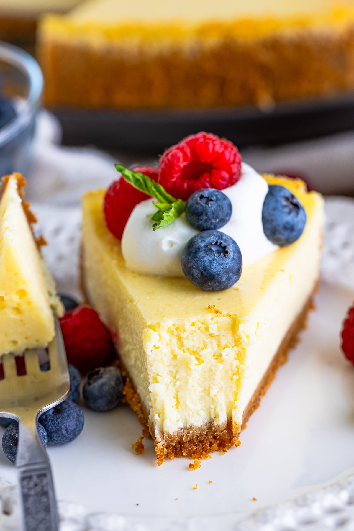 a slice of Cottage Cheese Cake on a plate with a bite taken out
