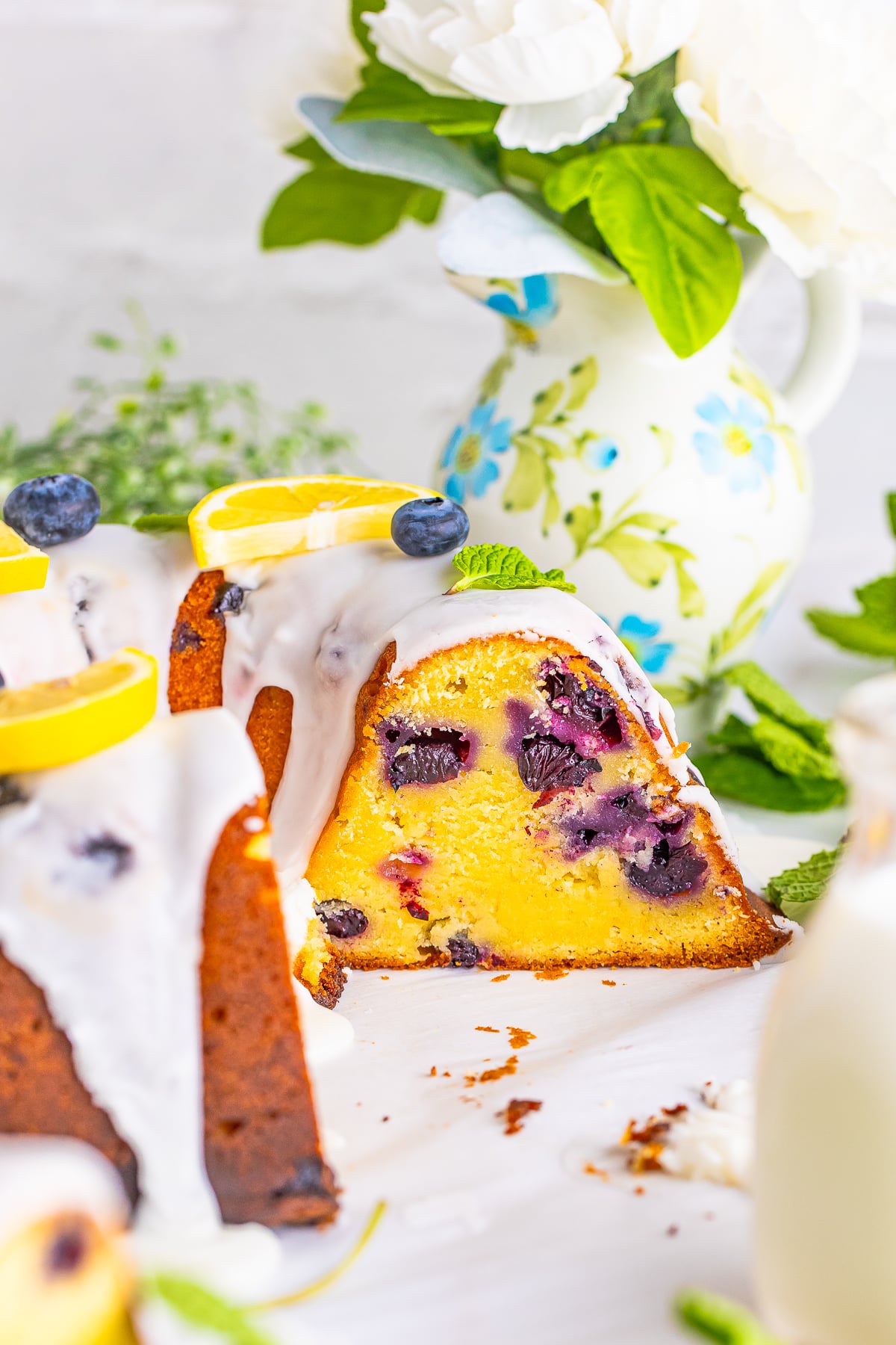 lemon blueberry pound cake with slices taken out 