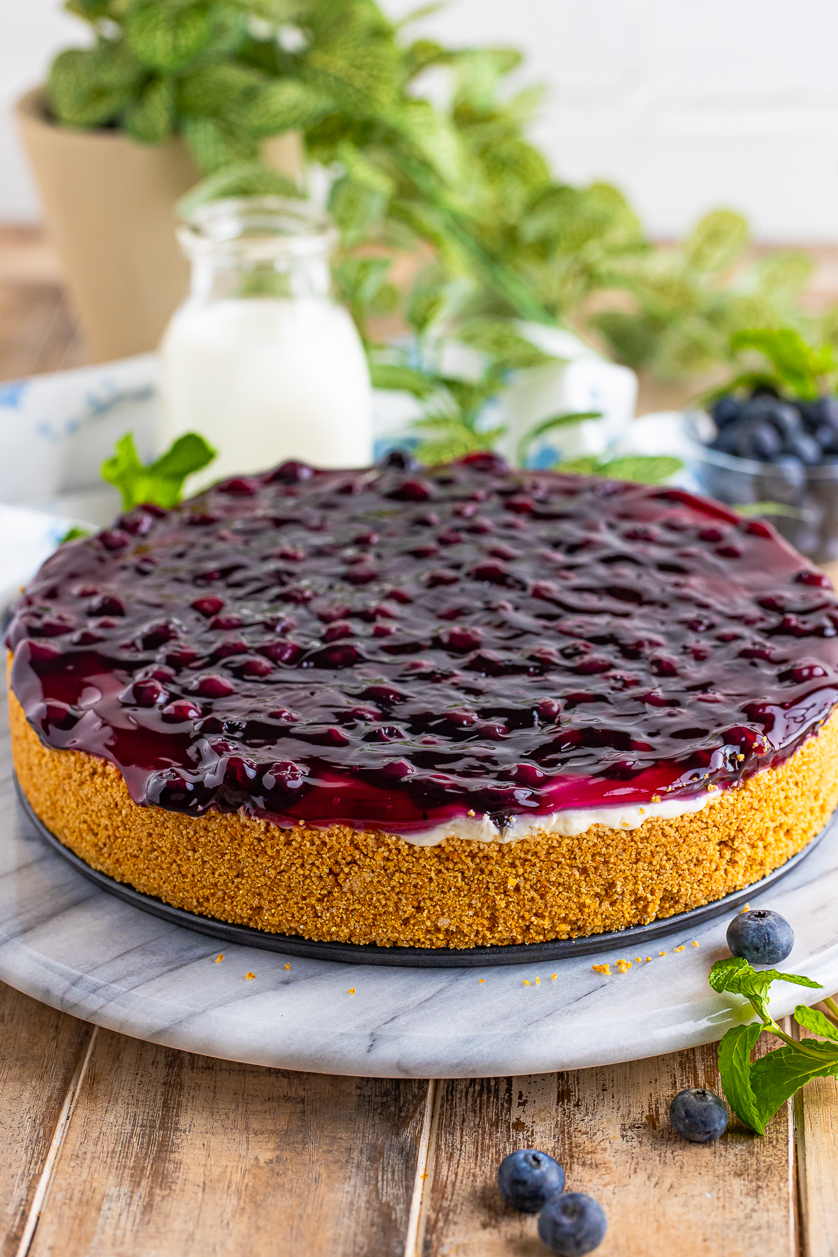 whole No Bake Cheesecake with Blueberries on cake stand