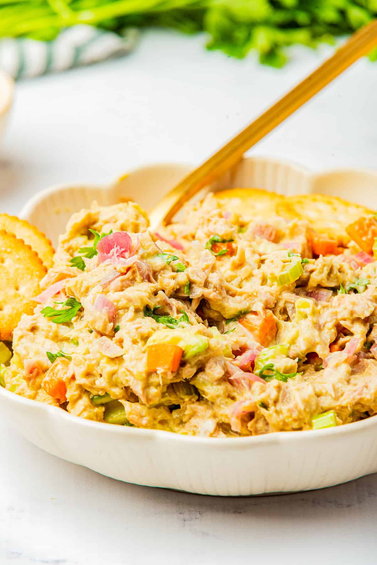 Tuna Salad Recipe served in a white bowl with crackers