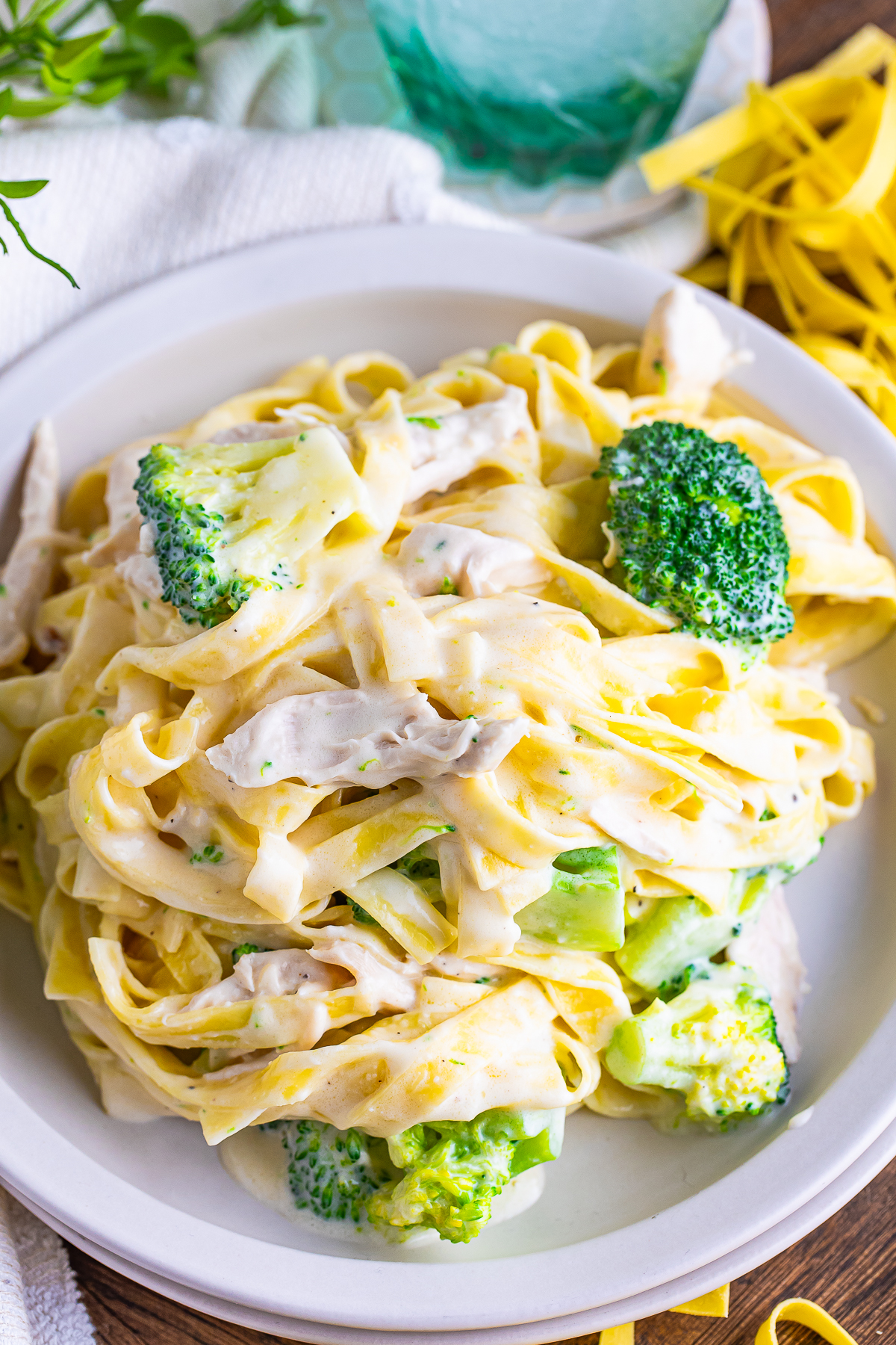 overhead close up image of Chicken and Broccoli Fettuccine Alfredo on serving plate