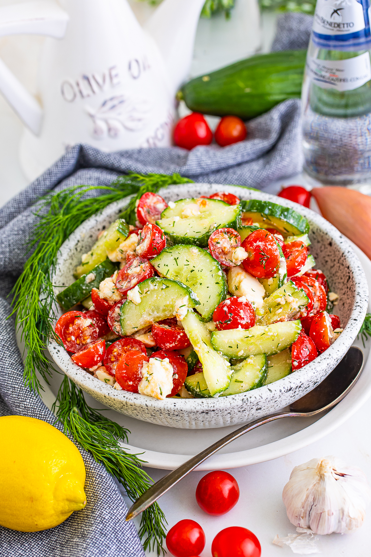 Cucumber Tomato Feta Cheese Salad served in a speckled bowl
