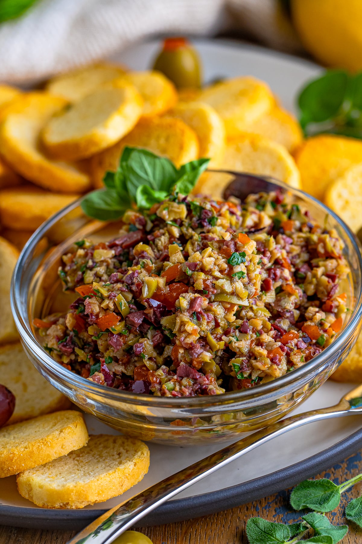 up close image of finished olive tapenade in a serving bowl