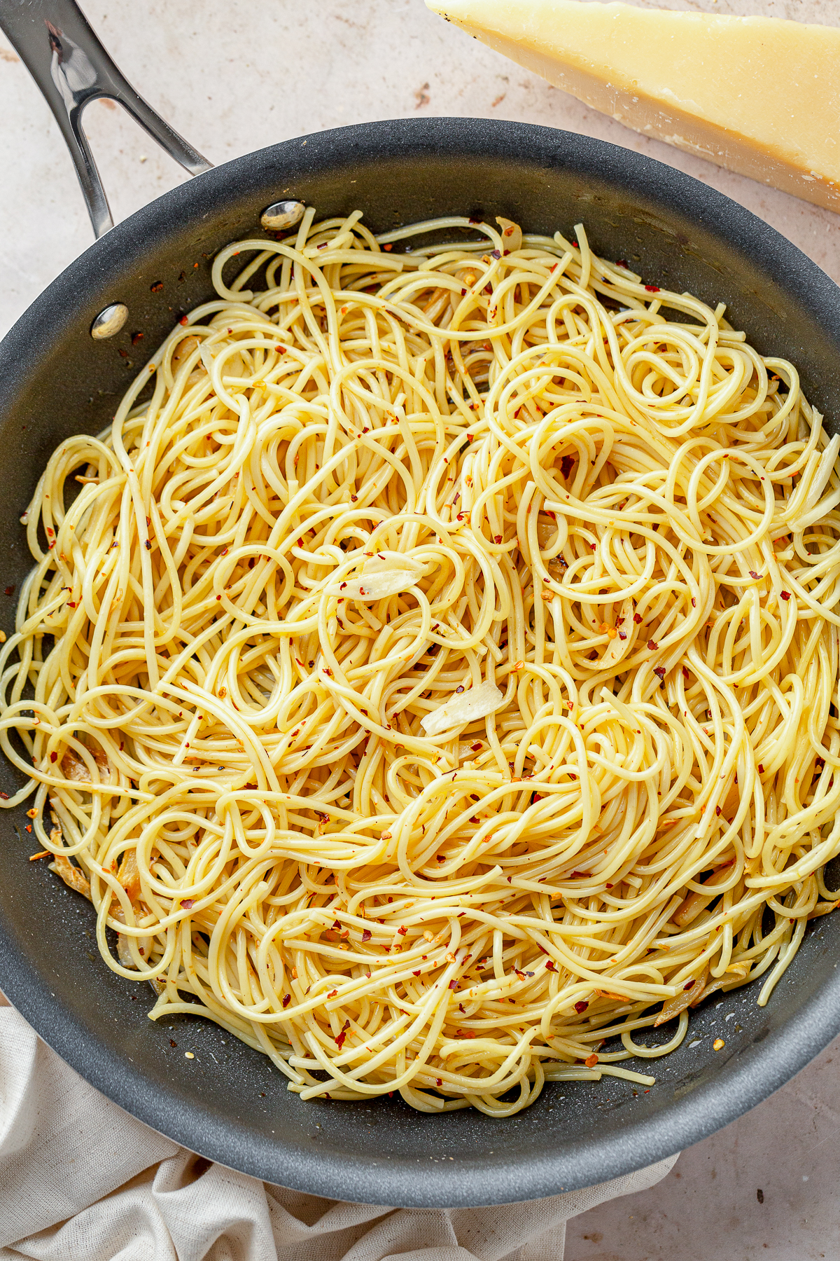 Some nights you want the big Sunday sauce that simmers all afternoon. Other nights, it’s 6 p.m., everyone is hungry, and the fridge looks empty. Enter Aglio e Olio.