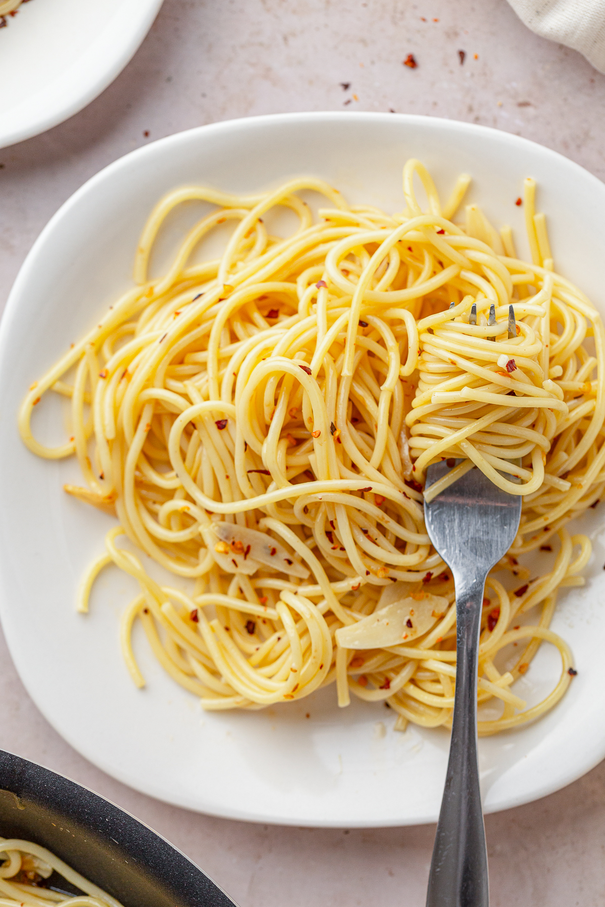 Some nights you want the big Sunday sauce that simmers all afternoon. Other nights, it’s 6 p.m., everyone is hungry, and the fridge looks empty. Enter Aglio e Olio.