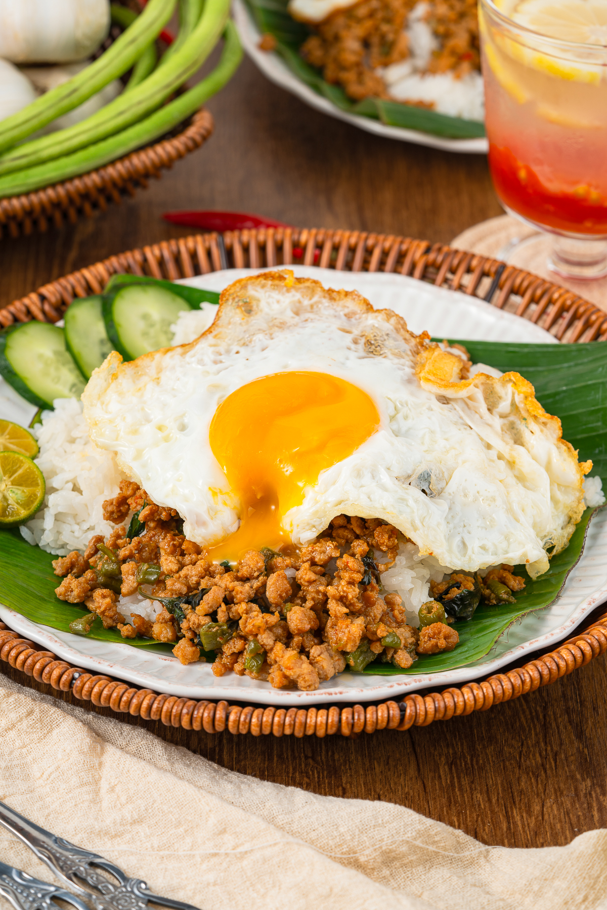 Let’s talk about one of the most popular Thai street food dishes—Phad Kra Pao! You may also see it spelled Pad Ka Prao or Pad Gaprao.