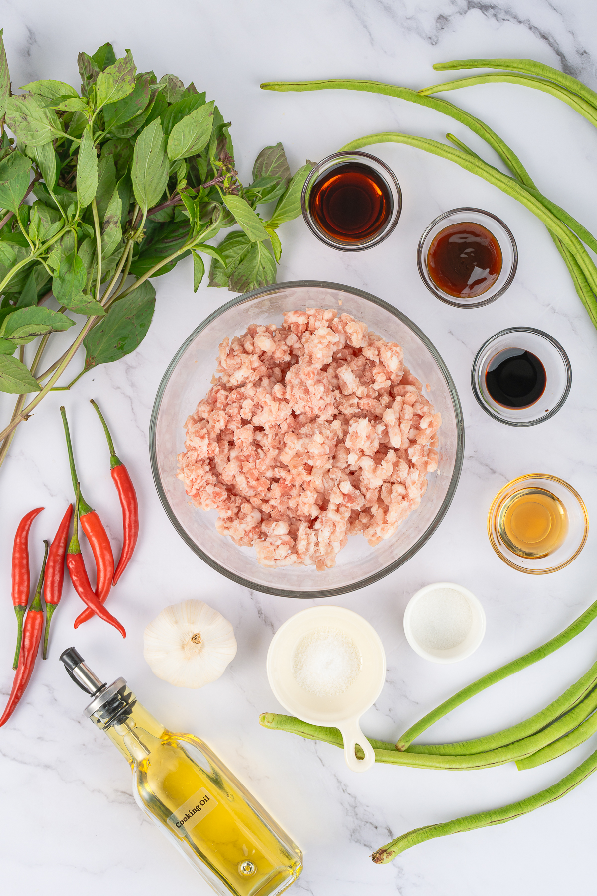 Let’s talk about one of the most popular Thai street food dishes—Phad Kra Pao! You may also see it spelled Pad Ka Prao or Pad Gaprao.