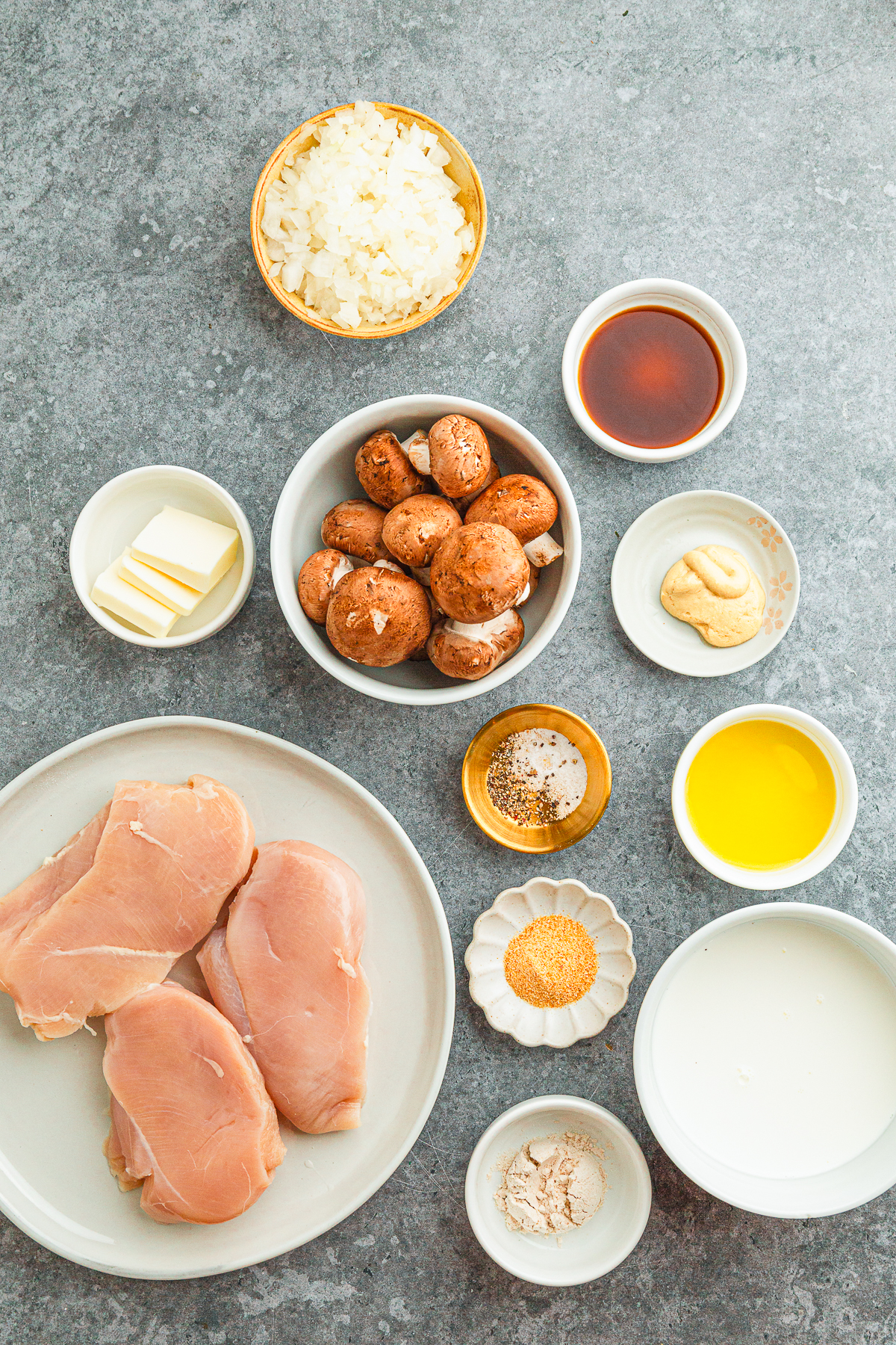 This is a picture of the ingredients boneless chicken (breast or thighs)

garlic powder

salt

black pepper

mushrooms

unsalted butter

diced onion

Dijon mustard

Worcestershire sauce

half‑and‑half (or heavy cream)

olive oil

all‑purpose flour

water or chicken broth