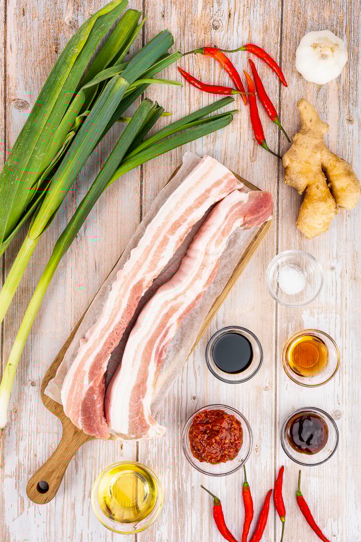 If you love bold flavors and quick dinners, Twice Cooked Pork might become your new best friend.

In China’s Sichuan Province, this dish is as famous as mapo tofu or red‑braised pork.

The Chinese name is hui guo rou, which means “returned‑to‑the‑wok pork.”

That’s because the pork belly really is Twice Cooked Pork, here: first it’s gently boiled, and then it’s hit with high heat in a sizzling stir fry!