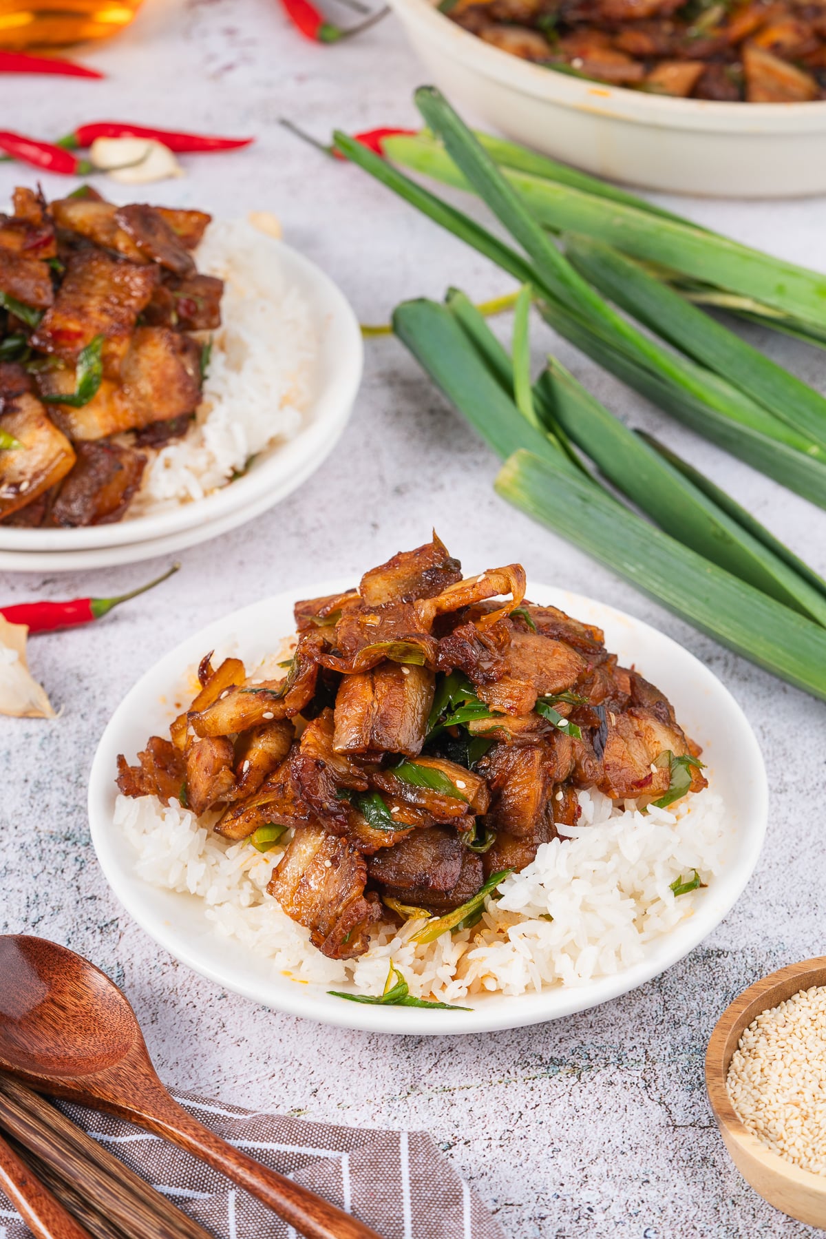 If you love bold flavors and quick dinners, Twice Cooked Pork might become your new best friend.

In China’s Sichuan Province, this dish is as famous as mapo tofu or red‑braised pork.

The Chinese name is hui guo rou, which means “returned‑to‑the‑wok pork.”

That’s because the pork belly really is Twice Cooked Pork, here: first it’s gently boiled, and then it’s hit with high heat in a sizzling stir fry!