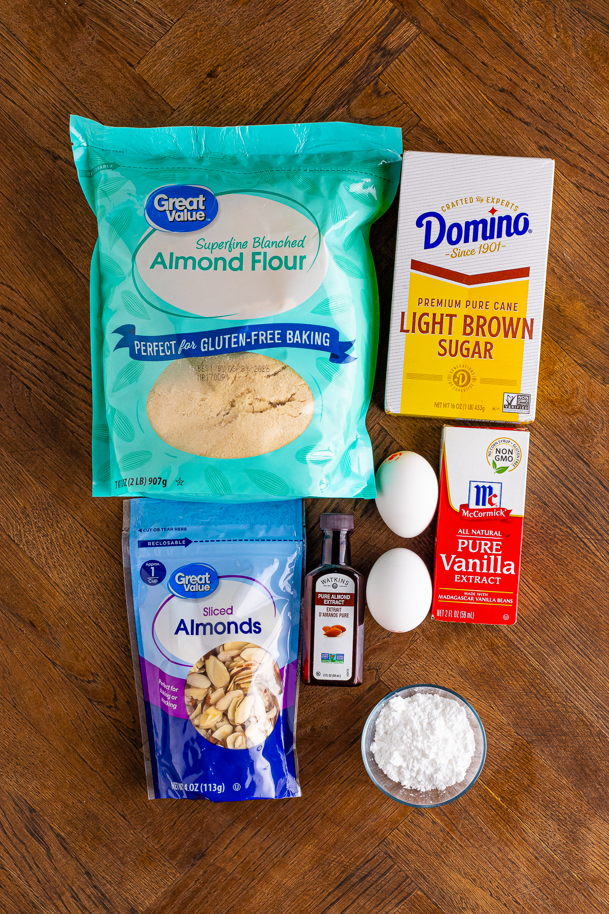 A visual representation of the ingredients listed:
almond meal
light brown sugar
large eggs
almond extract
vanilla extract
sliced almonds
powdered sugar