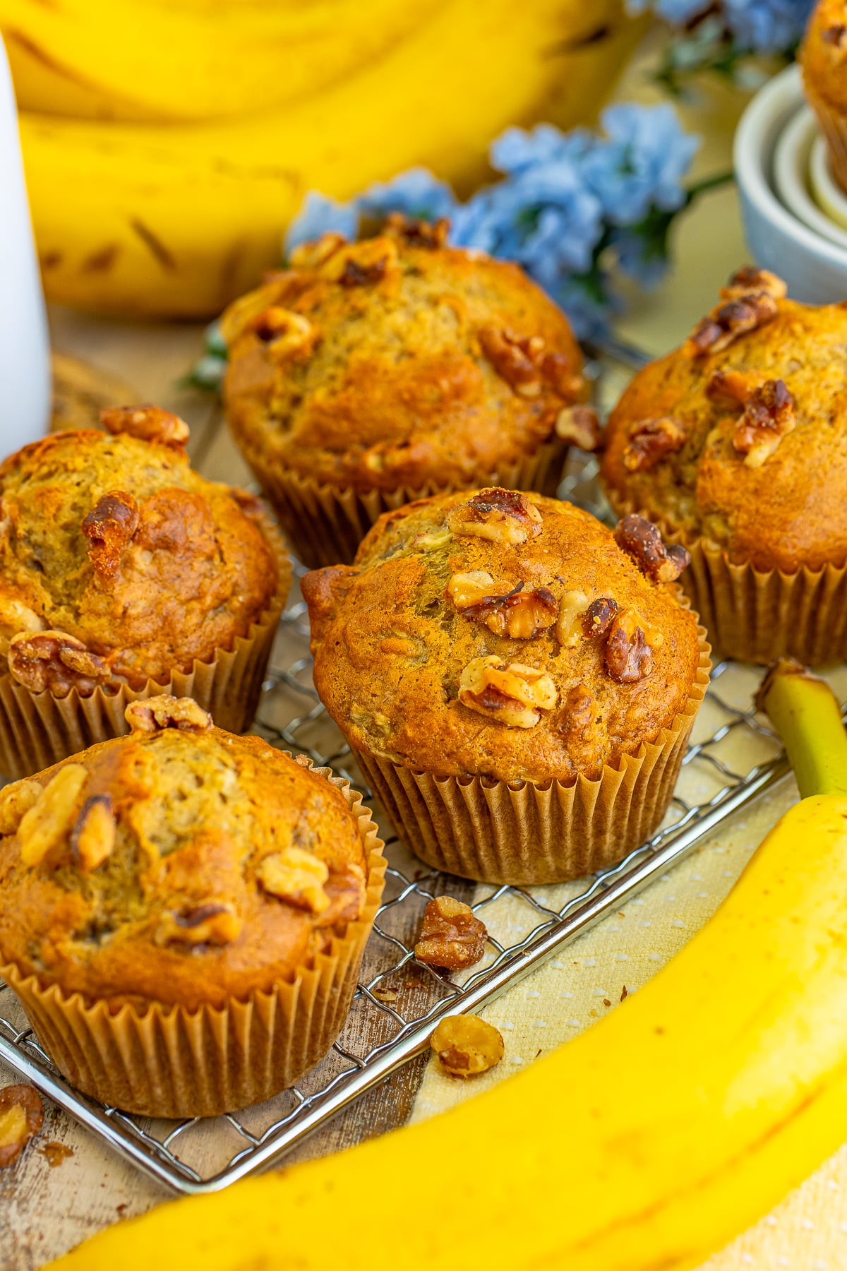 I love muffins because they’re quick bread you can eat with one hand while searching for your missing shoe. Ha!
These Banana Nut Muffins fit the bill.