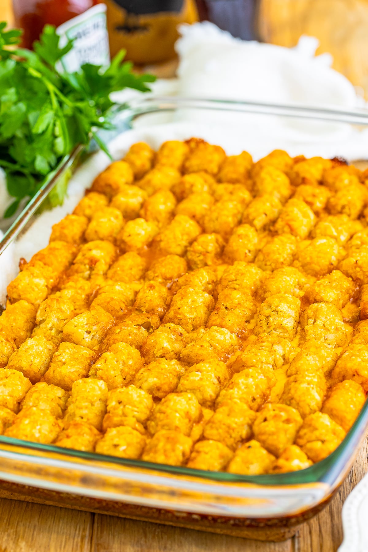 I grew up loving two things more than Saturday morning cartoons: gooey cheeseburgers and piles of crispy tater tots.
So, naturally, I eventually found the Cheeseburger Tater Tot Casserole!