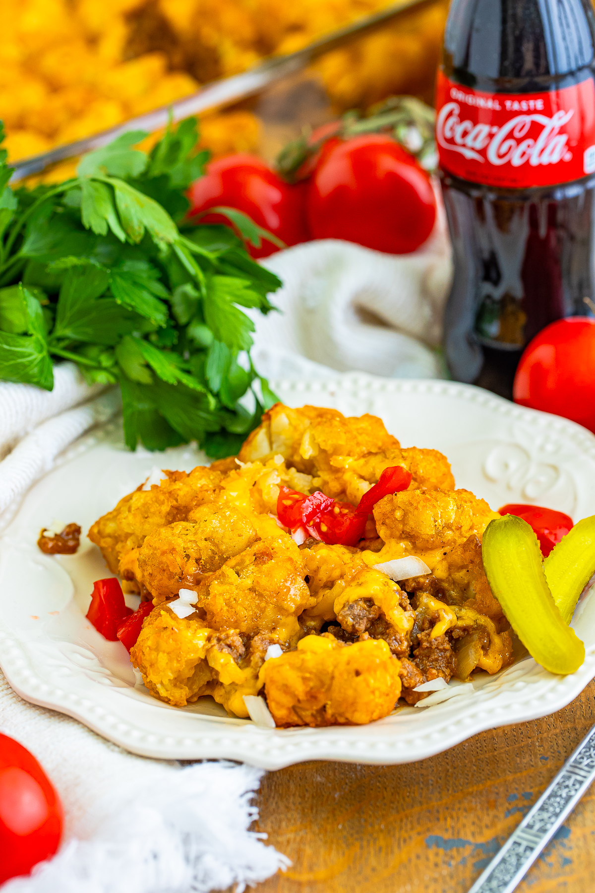 I grew up loving two things more than Saturday morning cartoons: gooey cheeseburgers and piles of crispy tater tots.
So, naturally, I eventually found the Cheeseburger Tater Tot Casserole!