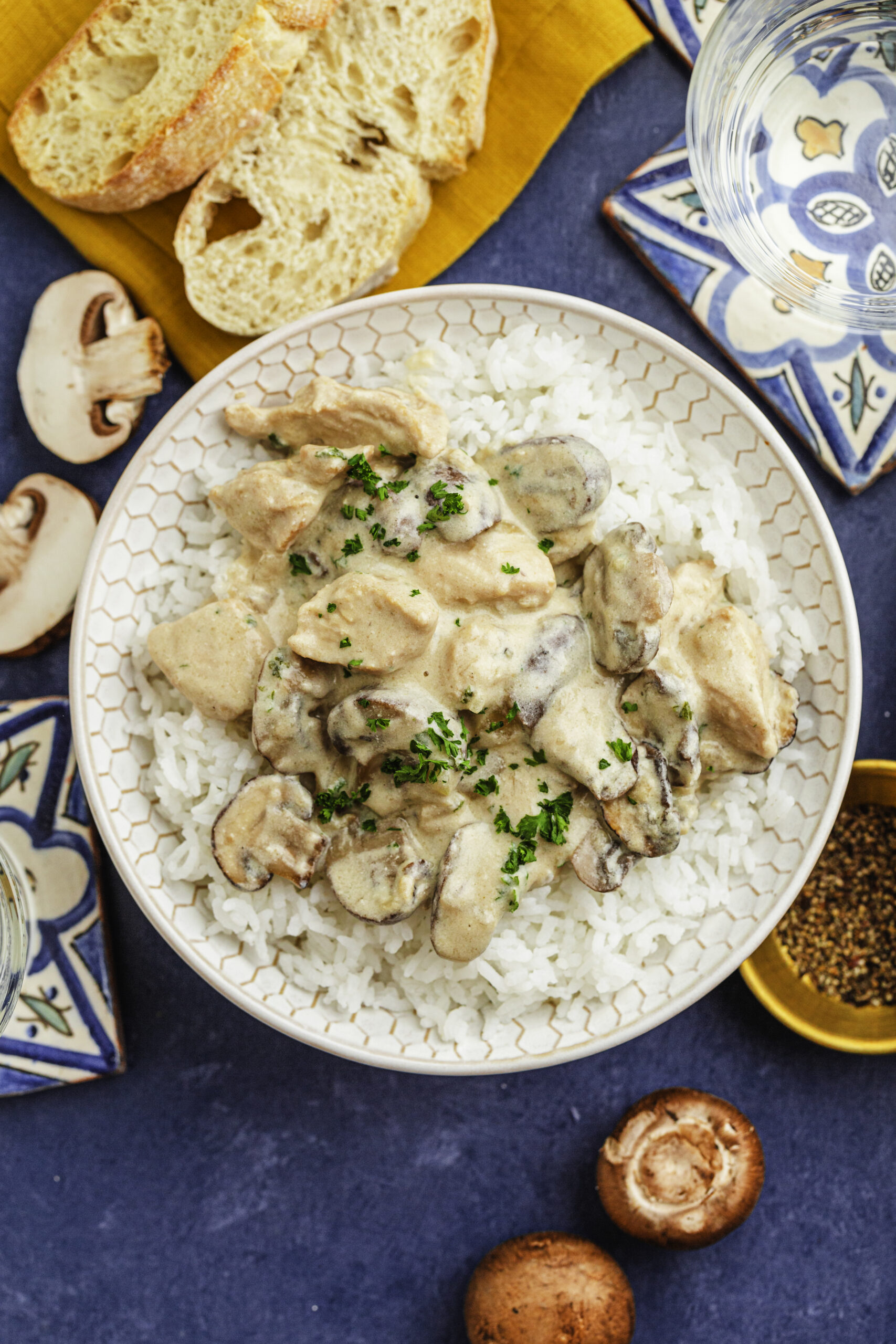 Another picture of the plate of chicken stoganoff with mushrooms and a crostini.