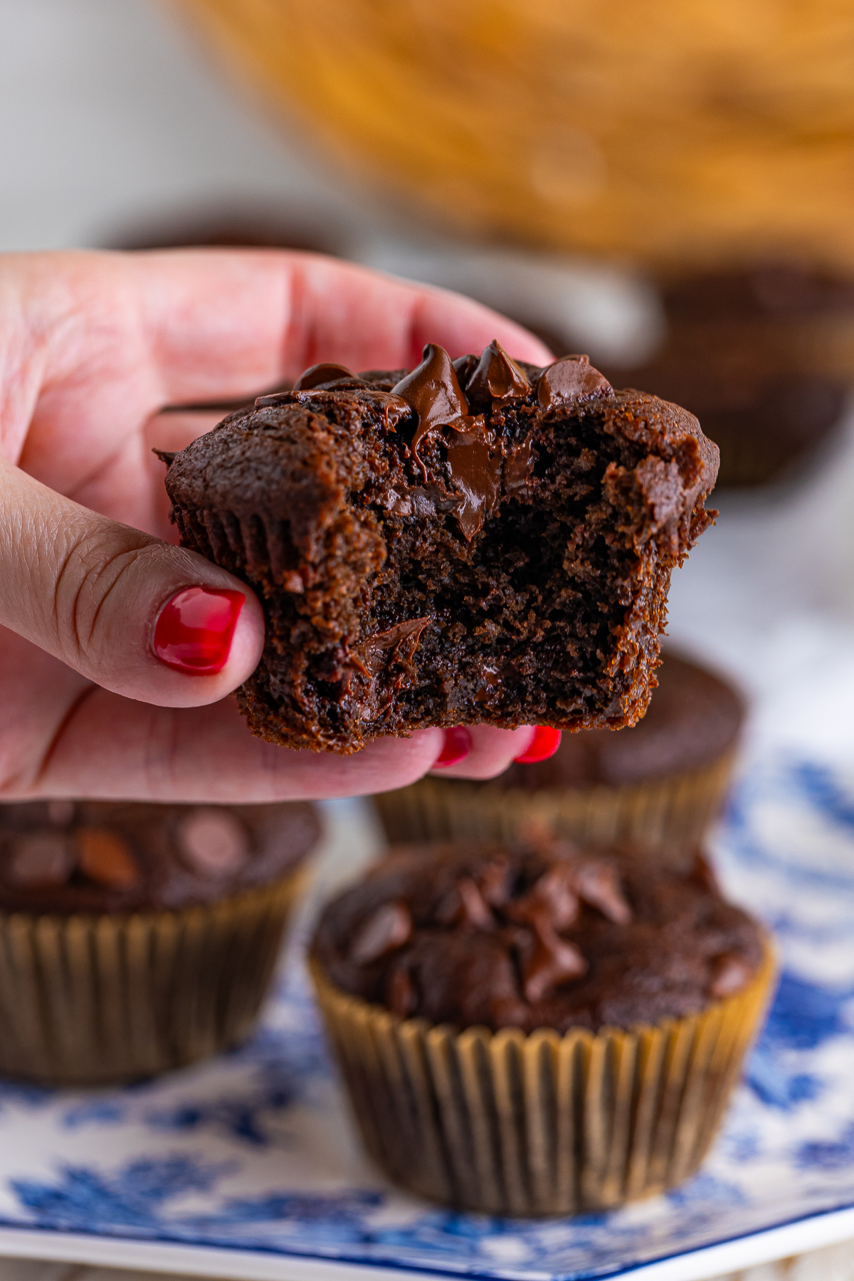 Who doesn’t get excited when the kitchen smells like warm, gooey chocolate?

 These Chocolate Muffins are the kind you see in a coffee shop bakery case—soft, fluffy muffins filled with melty dark chocolate chips and topped with extra chocolate chunks for good measure.

You can whip up a whole batch of chocolate muffins at home with simple ingredients you probably already have in your pantry!