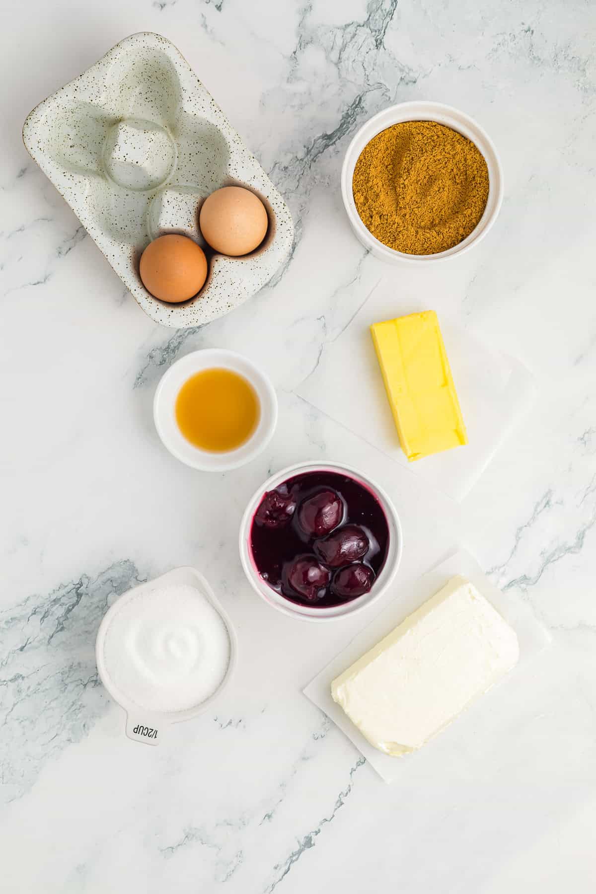 List of ingredients
Graham cracker crumbs
Melted butter
Granulated sugar
Cream cheese
Sugar
Eggs
Vanilla extract
Cherry pie filling (or your topping of choice)