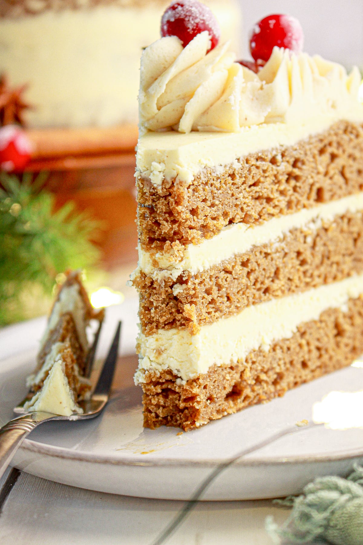 A glorious picture of a fork cutting the cake with a decadent sponge.