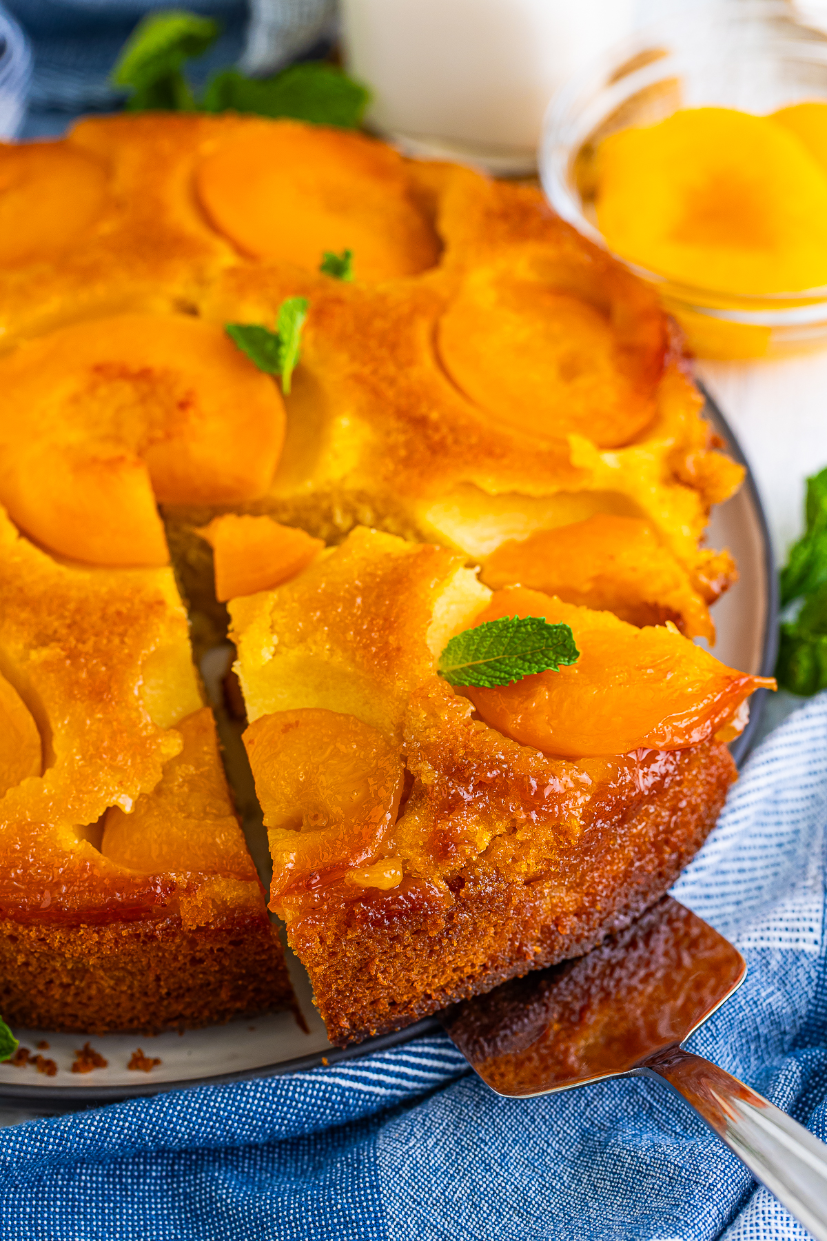 There’s nothing better on the warm days of peach season than a slice of Upside Down Cake with Peaches. 

Sweet peaches baked under buttery brown‑sugar syrup and flipped to shine on top of the cake!