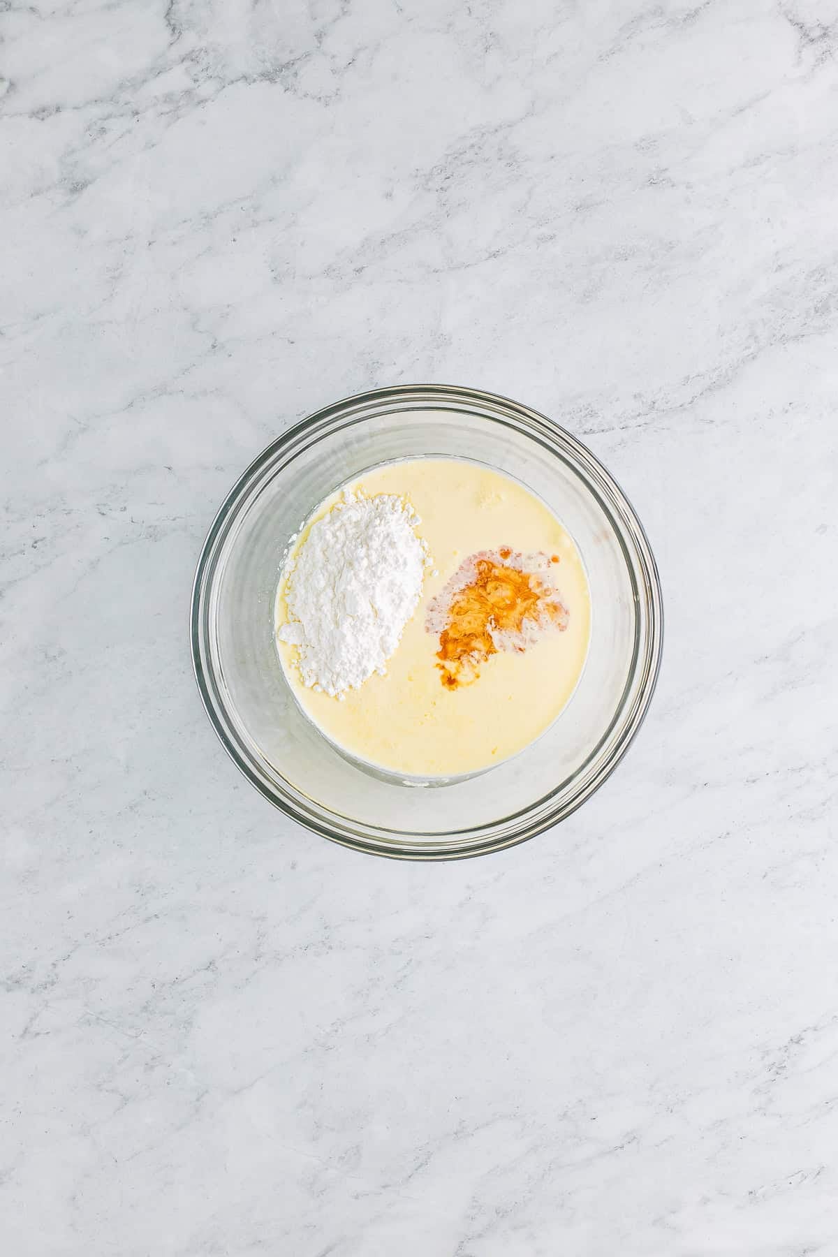 Heavy cream, powdered sugar, vanilla, and butter extract whipped into stiff peaks for the topping on a Butterbeer Recipe.