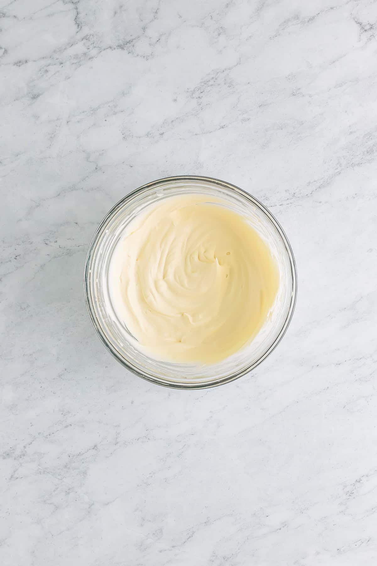 Butterscotch syrup folded into the whipped cream until smooth with no streaks for a Butterbeer Recipe.