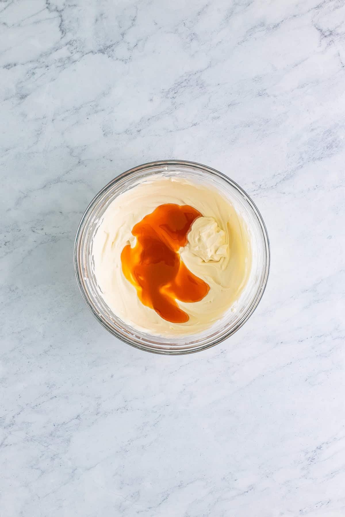 Cream soda, butterscotch syrup, and butter extract whisked together in a pitcher for a Butterbeer Recipe.