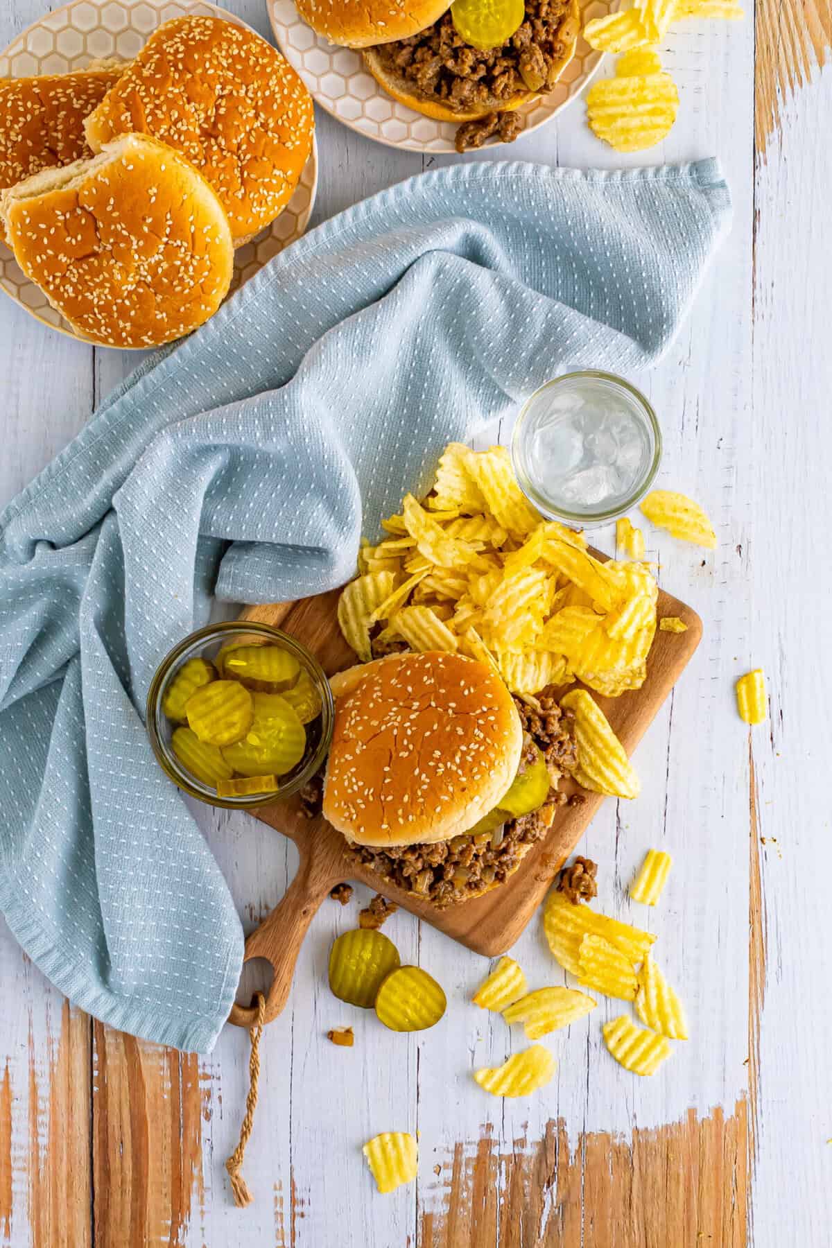 Plated Best Copycat Maid Rite Recipe loose meat sandwich with pickles ready to eat.