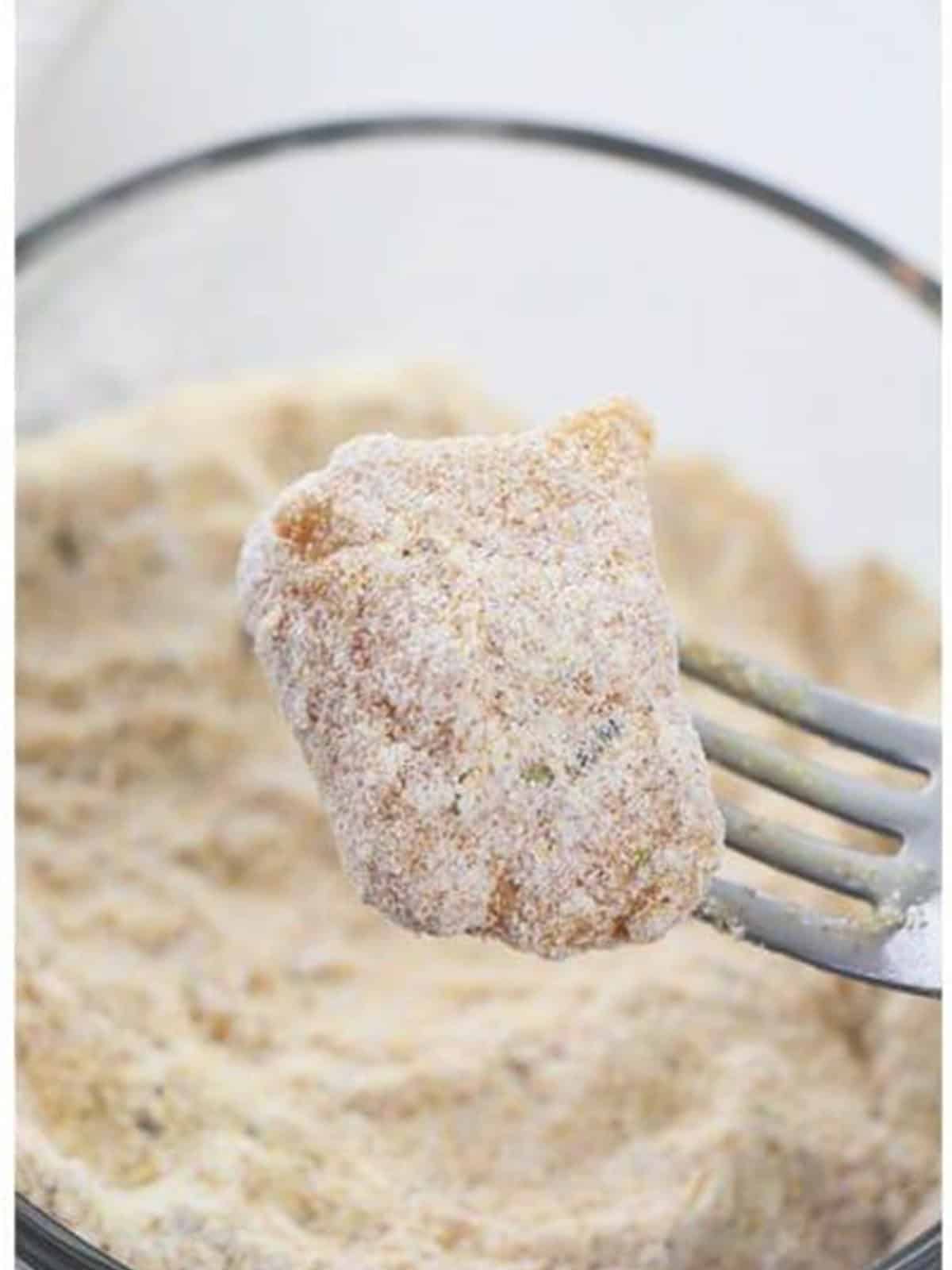 Fully breaded catfish nugget coated in the cornmeal mixture.