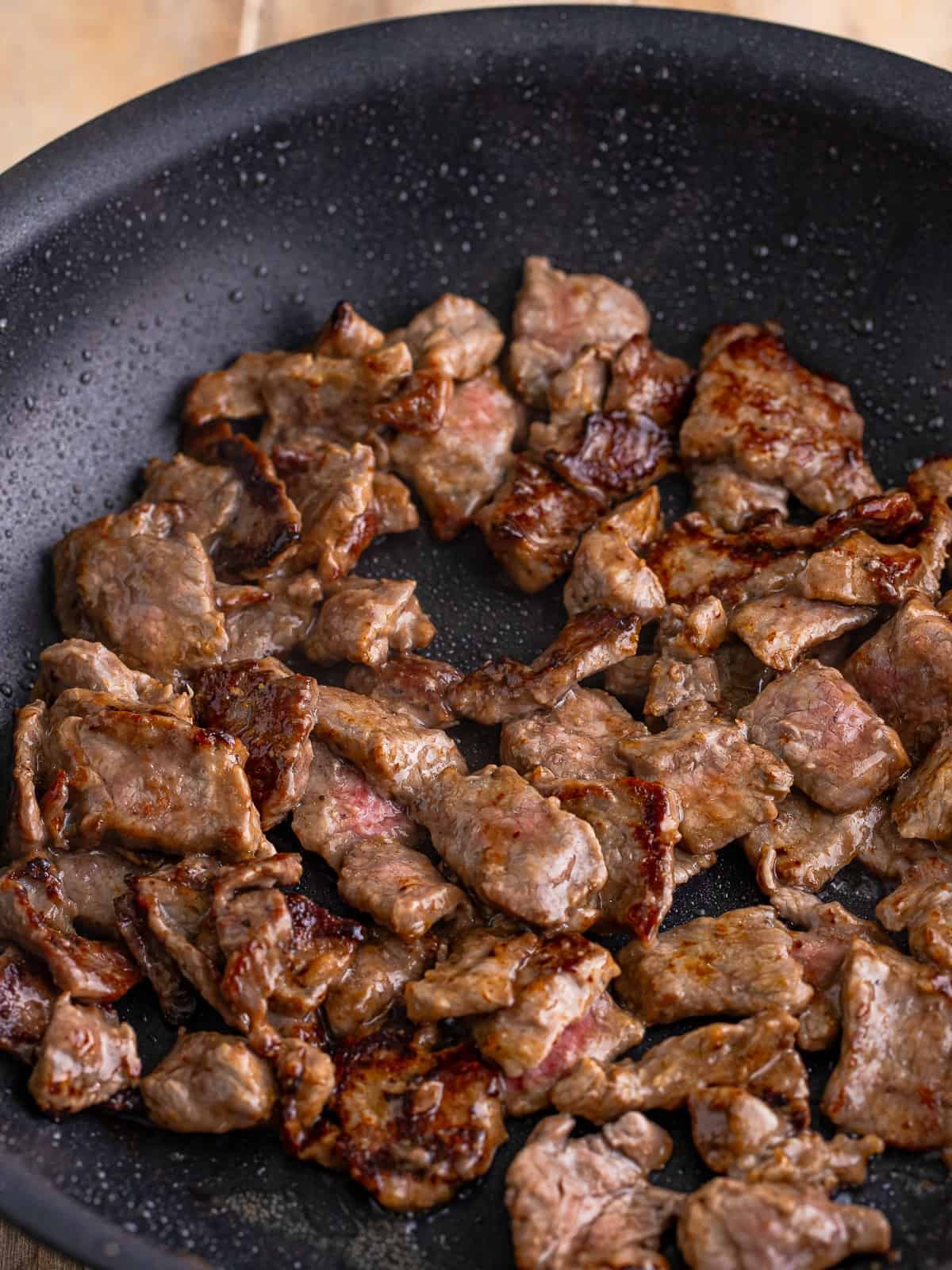 Browning beef tips in a skillet for beef tips and noodles.