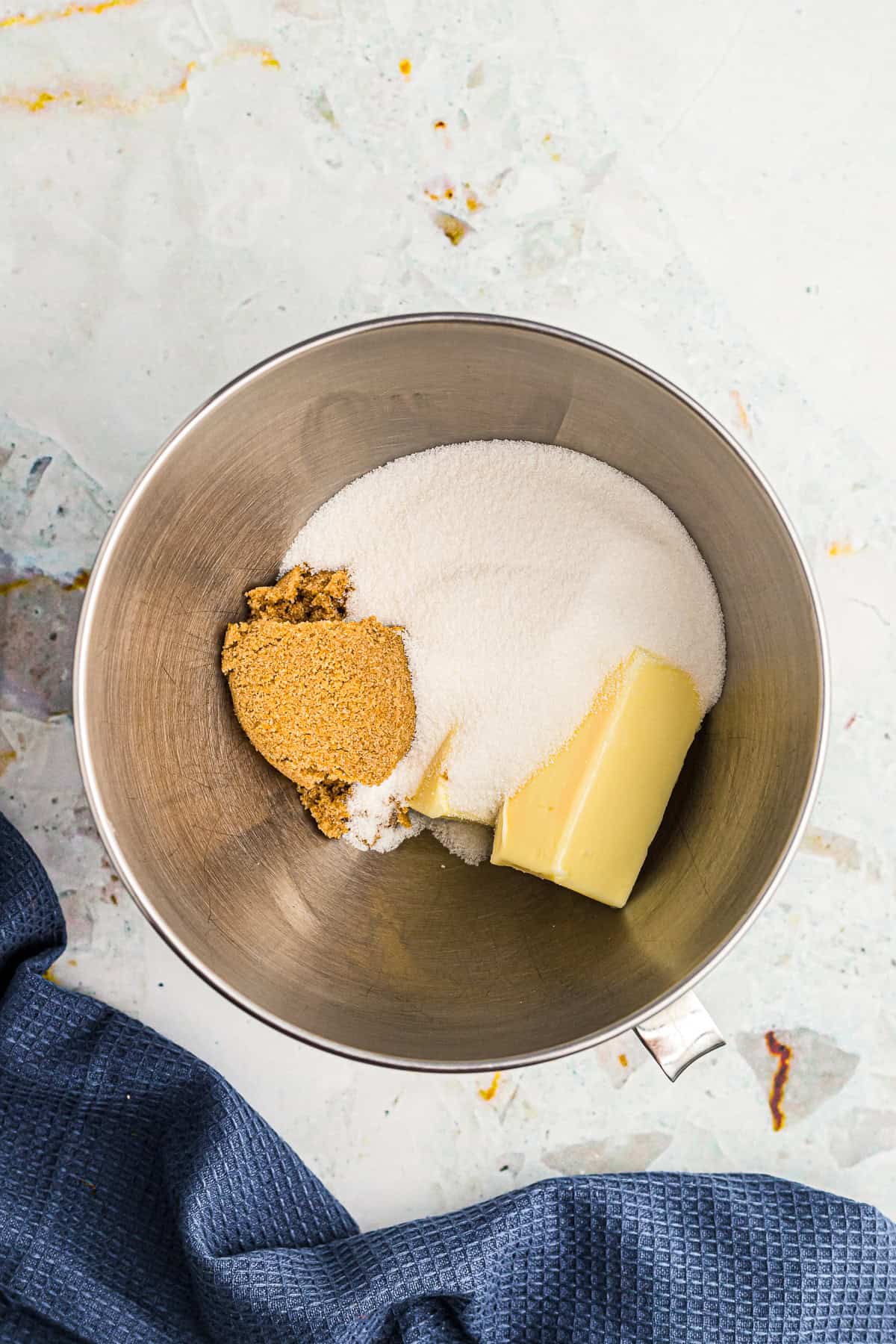 Butter creamed with granulated sugar and brown sugar in a stand mixer bowl for Chocolate Espresso Cake batter.