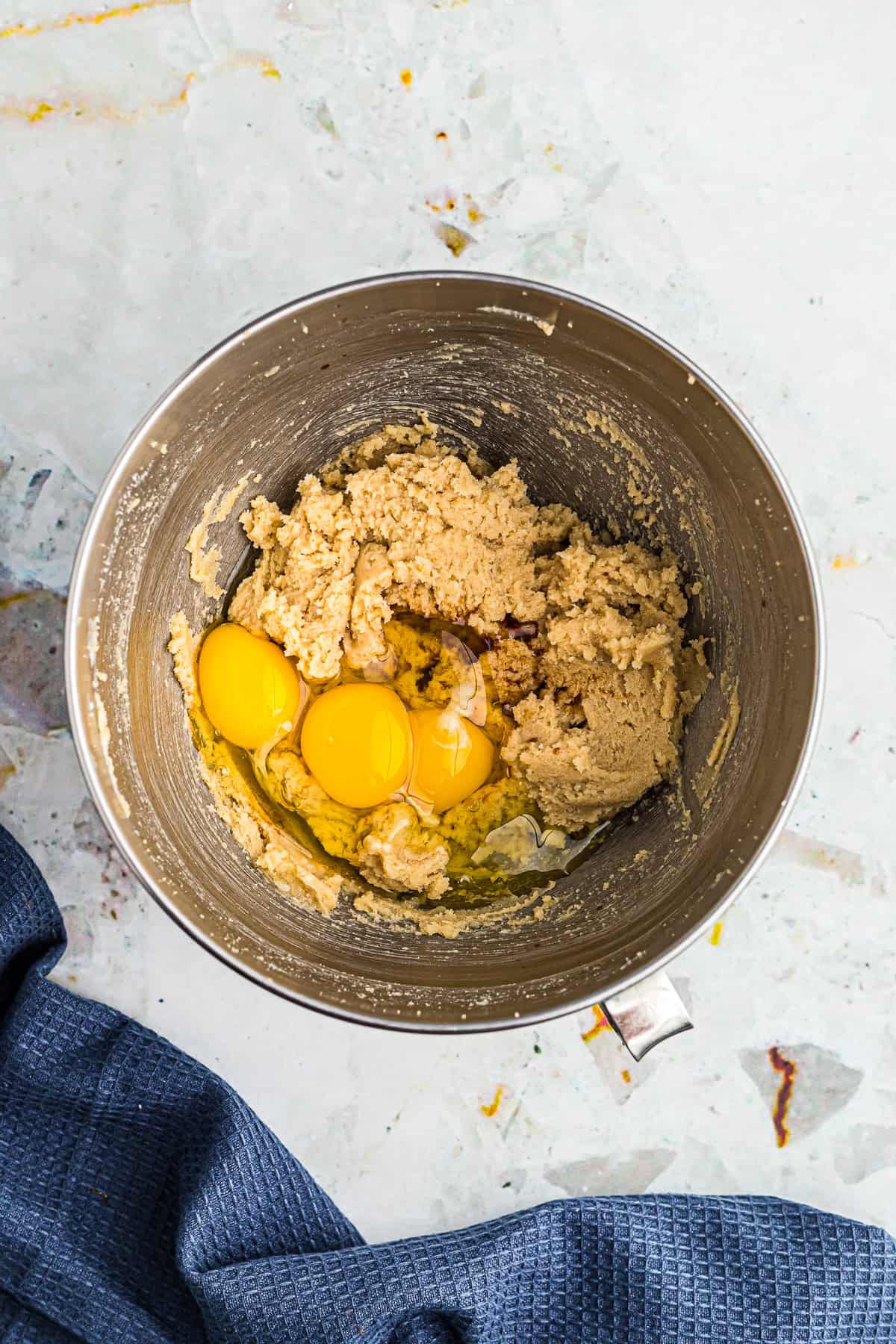 Eggs and vanilla extract added into the creamed butter and sugar mixture for Chocolate Espresso Cake.