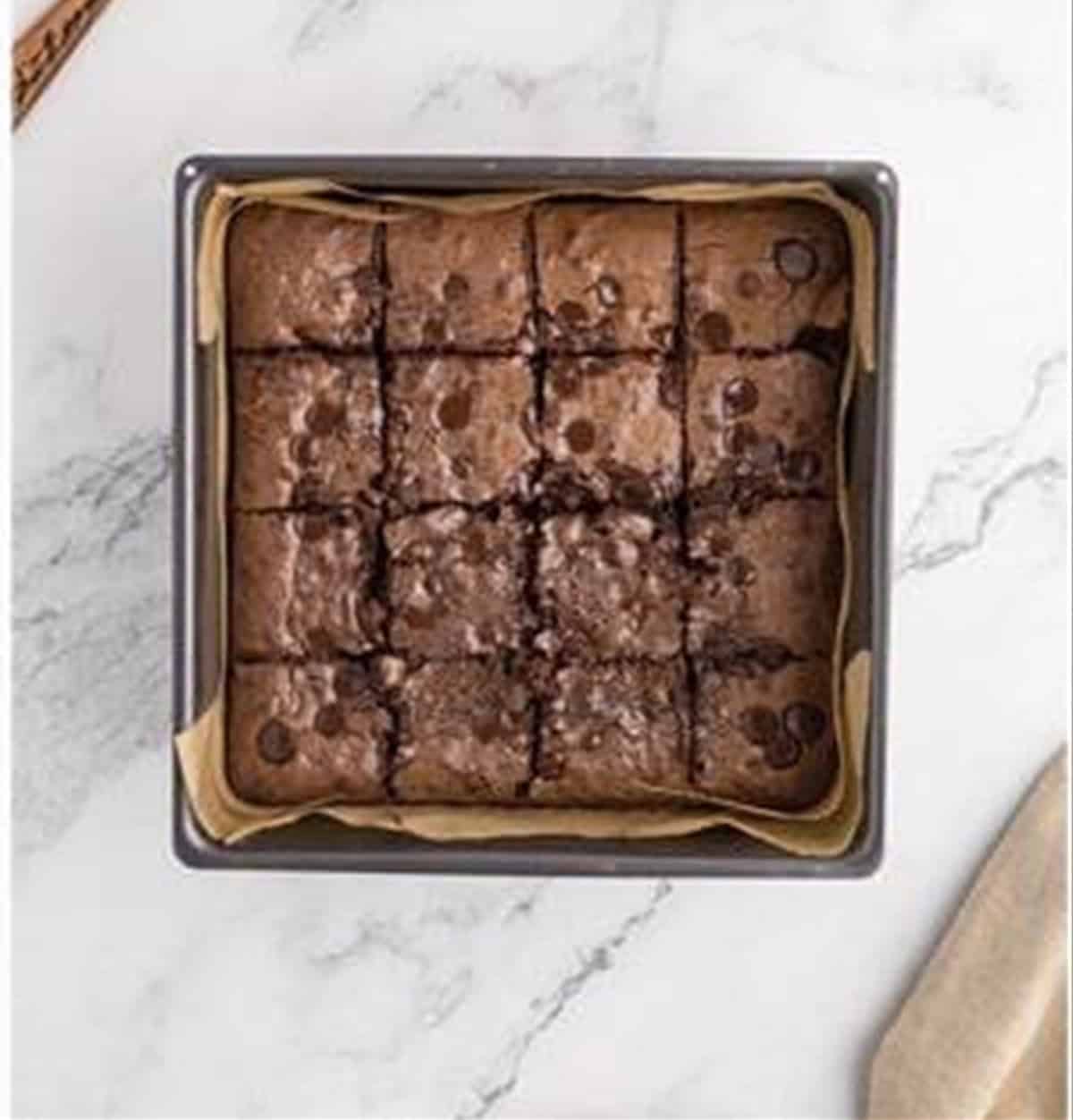Fudgy condensed milk brownies sliced into squares.