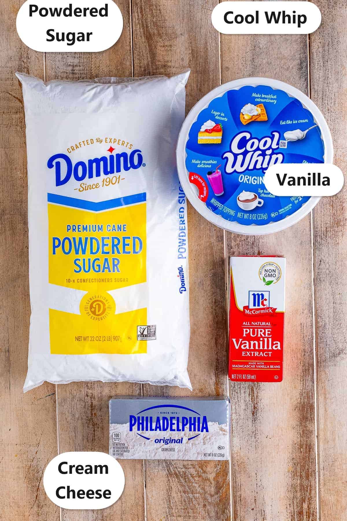 Labeled ingredients flat lay showing Powdered Sugar, Cream Cheese, Cool Whip, and Vanilla extract for the Easy Cream Cheese Fruit Dip Recipe.