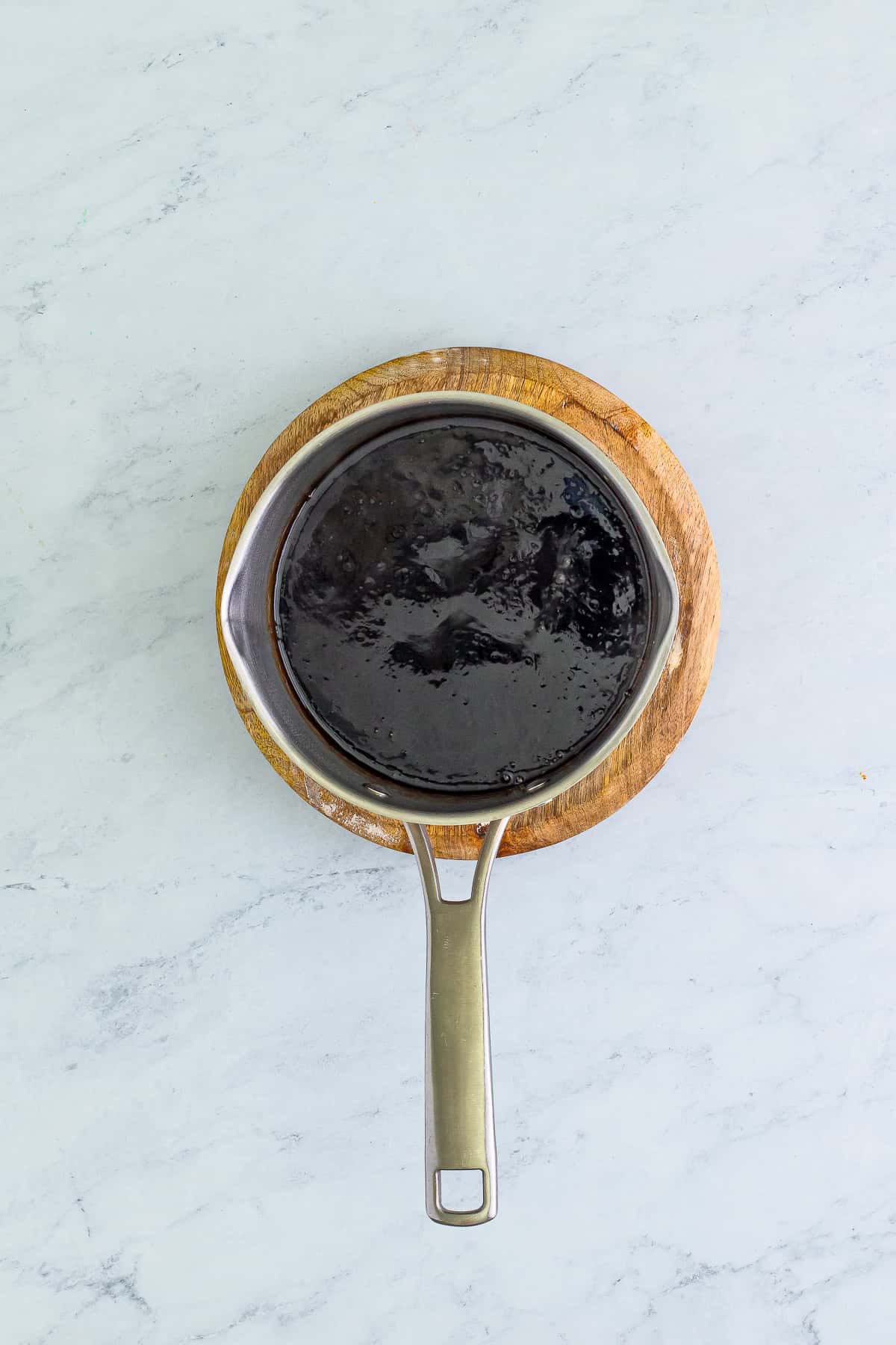 Thickened brown egg foo young gravy in a small saucepan.
